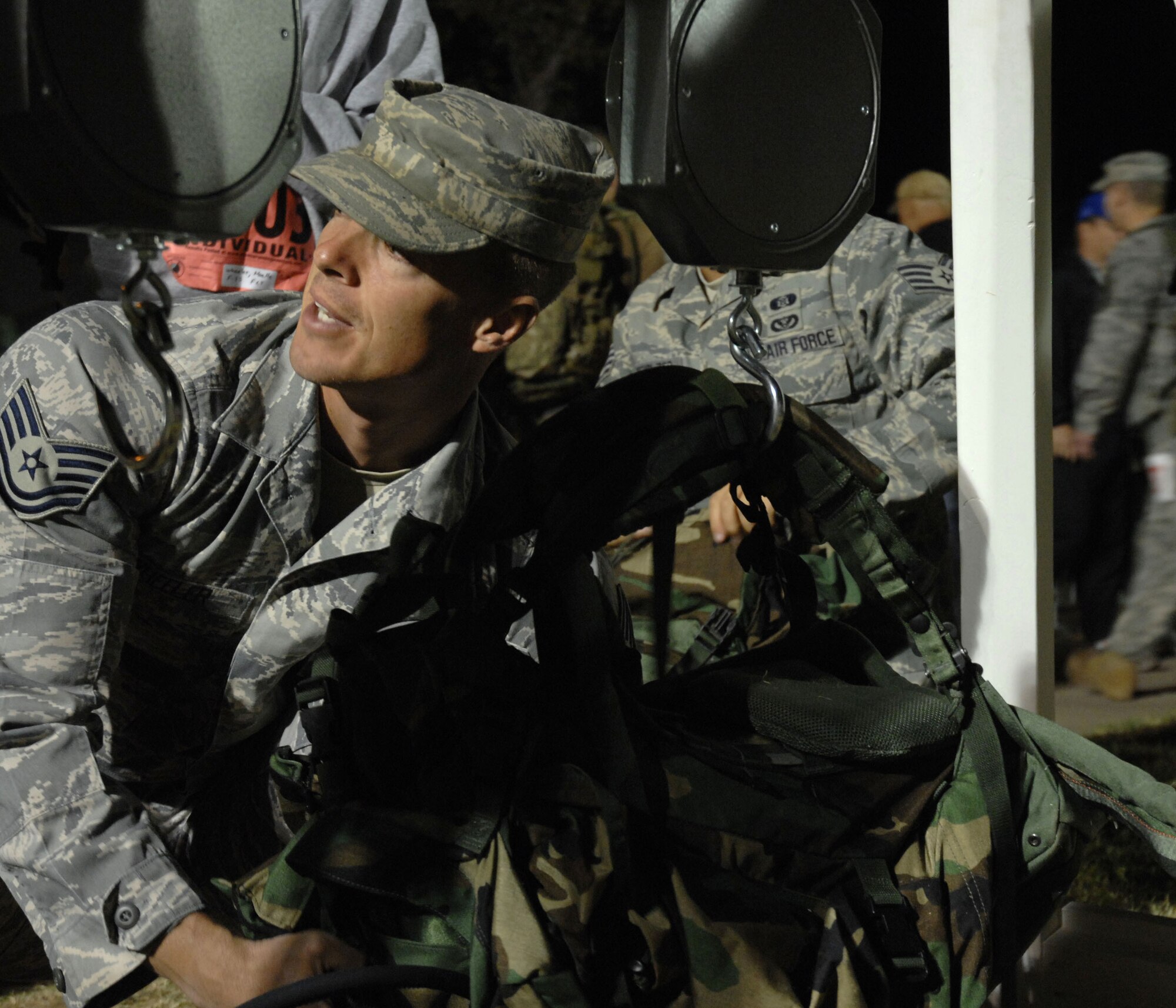 WHITE SANDS MISSILE RANGE, N.M. - Tech. Sgt. Daniel Wheeler, 737th Training Squadron, Lackland AFB, Texas, weighs his rucksack before beginning the 19th Annual Bataan Death Memorial Death March on March 30. More than 4,400 runners and marchers participated in the 26.2 or 15-mile run/walk. (U.S. Air Force photo by Airman 1st Class Evelyn Chavez)