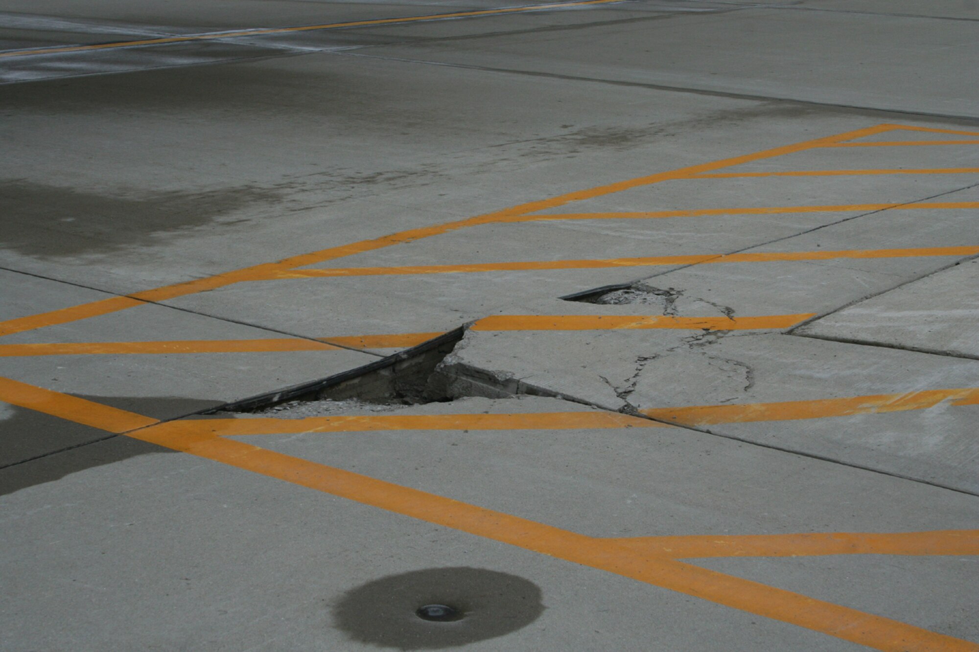 A parked C-5 Galaxy operated by the 445th Airlift Wing, Air Force Reserve Command, was struck by lightning March 28, 2008. The lightning strike traveled from the tail section through the aft ramp area of the plane and to the grounding cords before it hit the concrete.  (U.S. Air Force photo/Mary Allen)

 
