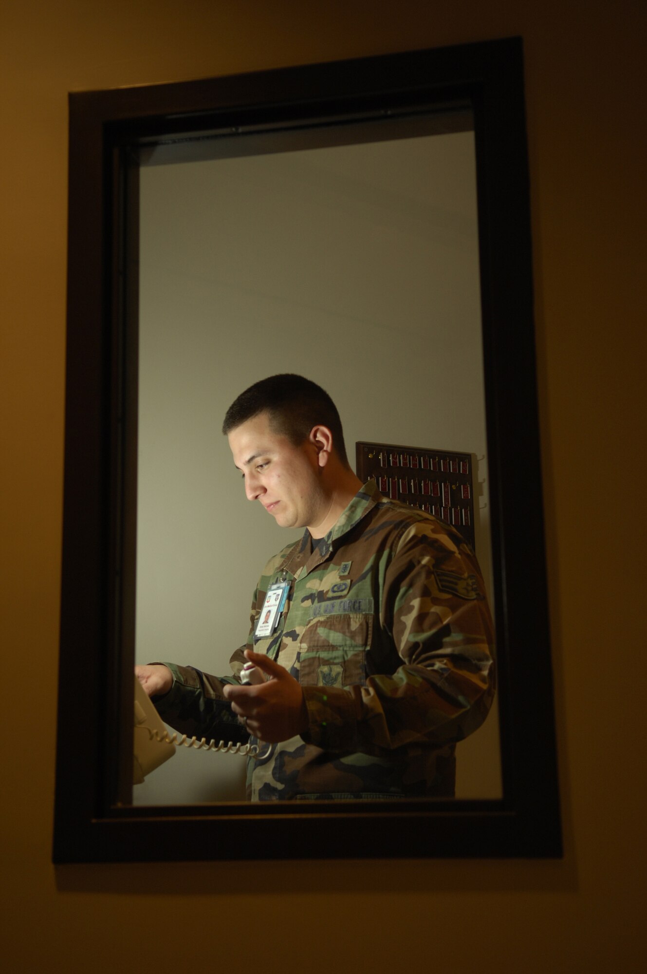 MOODY AIR FORCE BASE, Ga. -- Senior Airman Brian Hermes, Diagnostic Imaging technician for the 23rd Medical Group, operates the X-ray control console in the exposure room during training here Feb 19. The radiology flight uses fully digital equipment to streamline the patient diagnostic process. (U. S. Air Force photo by Senior Airman Elizabeth Rissmiller)