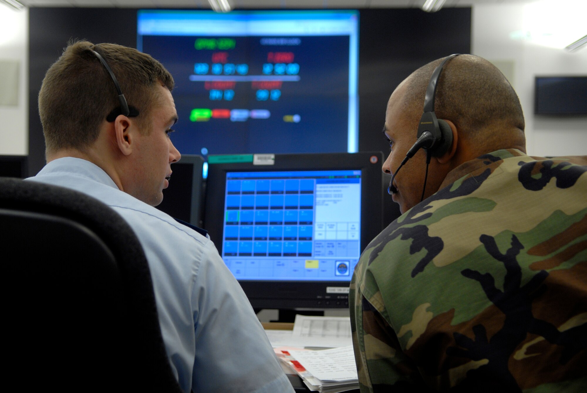 VANDENBERG AIR FORCE BASE, Calif. -- 1st Lt. Michael Hoadley, a flight vehicle engineer with the 4th Space Launch Squadron, and Capt. A.J. Ashby, 4th SLS flight commander, go through terminal count down and procedures during a Guardian Challenge launch rehearsal on March 28. The GC trainers provide a series of anomalous conditions. This provides the GC team with familiarity of the launch count down manual and trains them on some of the day-of-launch systems that can become problems or barriers in achieving a successful mission launch. (U.S. Air Force photo/Airman 1st Class Christian Thomas)