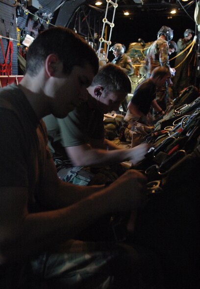 MOODY AIR FORCE BASE, Ga. – Pararescuemen with the 38th Rescue Squadron inspect their parachutes aboard a 71st Rescue Squadron HC-130P during a search for a missing sailboat in the Gulf of Mexico March 26. Had the boat been discovered and required assistance, the “PJ’s” would have deployed with an inflatable boat and supplies to render aid to the stricken mariners. (U.S. Air Force photo by Tech. Sgt. Parker Gyokeres)