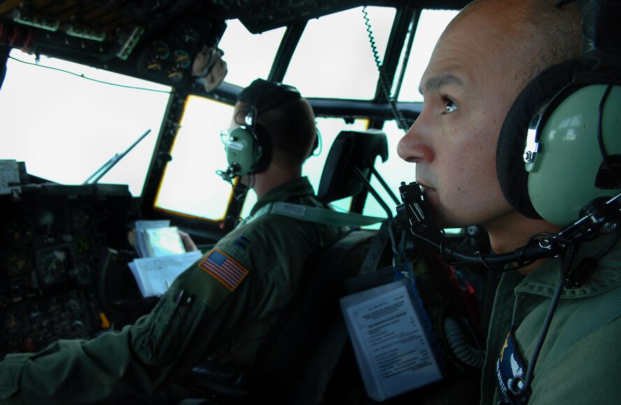 MOODY AIR FORCE BASE, Ga. – Staff. Sgt. Ken Martinez 71st Rescue Squadron HC-130P flight engineer, monitors an overhead instrument panel during a search and rescue mission for a missing sailboat in the Gulf of Mexico March 26. During long over-water flights such as this one, the flight engineer is responsible for maintaining the most efficient engine settings to keep a search team out longer. (U.S. Air Force photo by Tech. Sgt. Parker Gyokeres)