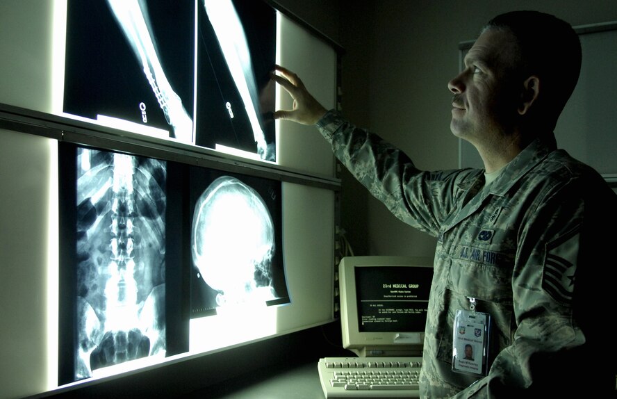MOODY AIR FORCE BASE, Ga. -- Master Sergeant Sean Kearley, NCO-in-charge of diagnostic imaging for the 23rd Medical Group, inspects training radiographs here Feb. 15. The radiology flight has the option to view radiographs here or send them electronically around the world. (U. S. Air Force photo by Senior Airman Elizabeth Rissmiller)