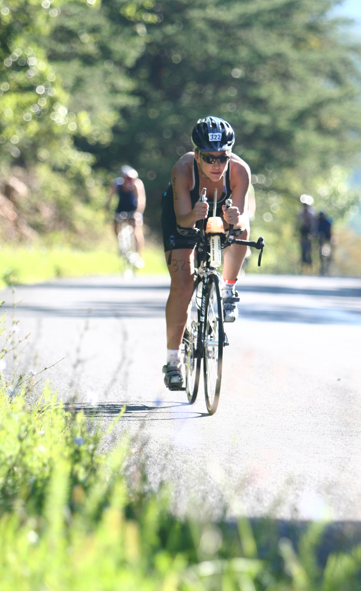 At the General Smallwood Triathlon (International Distance) in Indian Head, Md., Senior Master Sgt. Jennifer Burg negotiates a stretch of the 24.8-mile bicycle course in the “tri-bar” position, allowing her to maintain an aerodynamic posture while saving energy. (Photo courtesy of Senior Master Sgt. Jennifer Burg.)