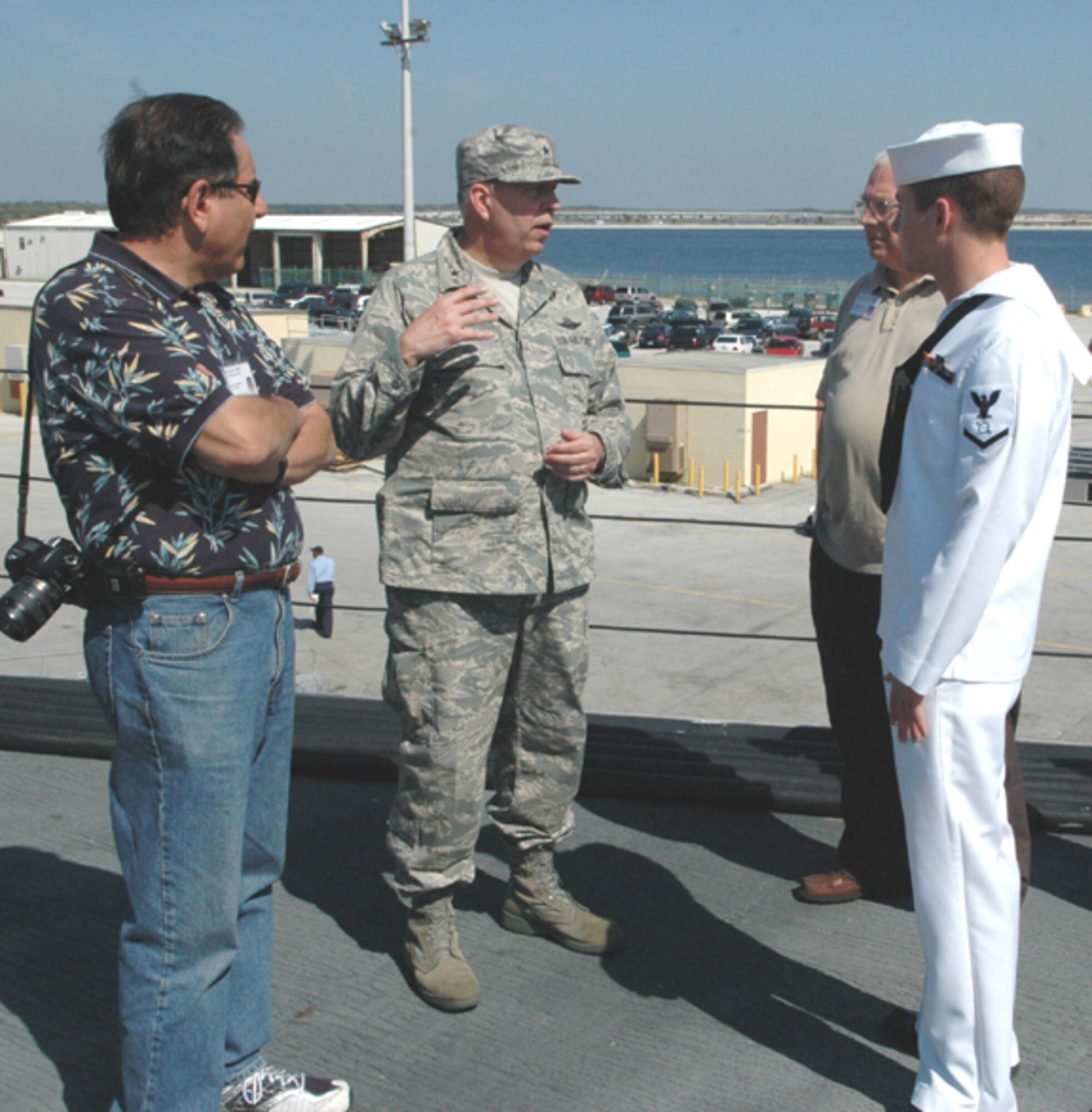GRISSOM AIR RESERVE BASE, Ind., -- (from left) Jim Yates, Brig. Gen. Dean Despinoy, and John Stackhouse visit with a sailor from the USS Dewert during a stop at Naval Station Mayport.  During the special two-day civic leader tour, community leaders from Indiana visited Patrick AFB and Naval Station Mayport, both in Florida.  General Despinoy, 434th Air Refueling Wing Commander, was the host of the civic leader trip.  (U.S. Air Force photo/Senior Airman Carl Berry)