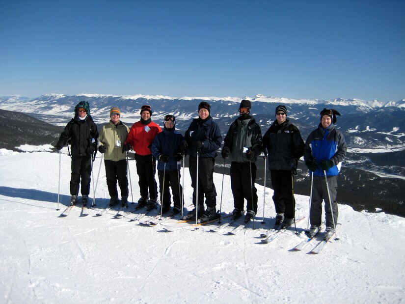 Eight of the sixteen students from the U.S. Air Force Expeditionary Center's Mobility Operations School Advanced Study of Air Mobility Course 2008 stop for a photo while skiing together in the Colorado Rocky Mountains Feb. 29, 2008.  The skiing was a camaraderie event for the students who traveled to Colorado to see Air Force Space Command, Cheyenne Mountain Air Force Station and other military venues.  The ASAM course is a year-long program centered out of the USAF EC in Fort Dix, N.J., where students, upon graduation, earn a Master of Air Mobility degree from the Air Force Institute of Technology.  (U.S. Air Force Photo)
