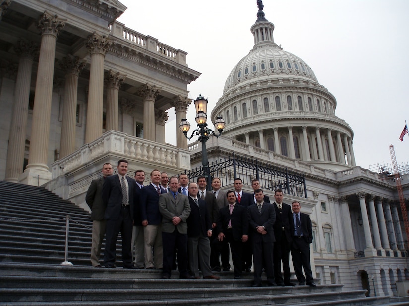 Students in the U.S. Air Force Expeditionary Center's Mobility Operations School Advanced Study of Air Mobility Course 2008 stand on the steps of the U.S. Capitol building Jan. 10, 2008, as part of a course field trip.  Sixteen Air Force majors are in the year-long course where they will earn a Master of Air Mobility degree from the Air Force Institute of Technology.  The course is operated at the Center in Fort Dix, N.J., and the current class graduates in June.  (U.S. Air Force Photo) 