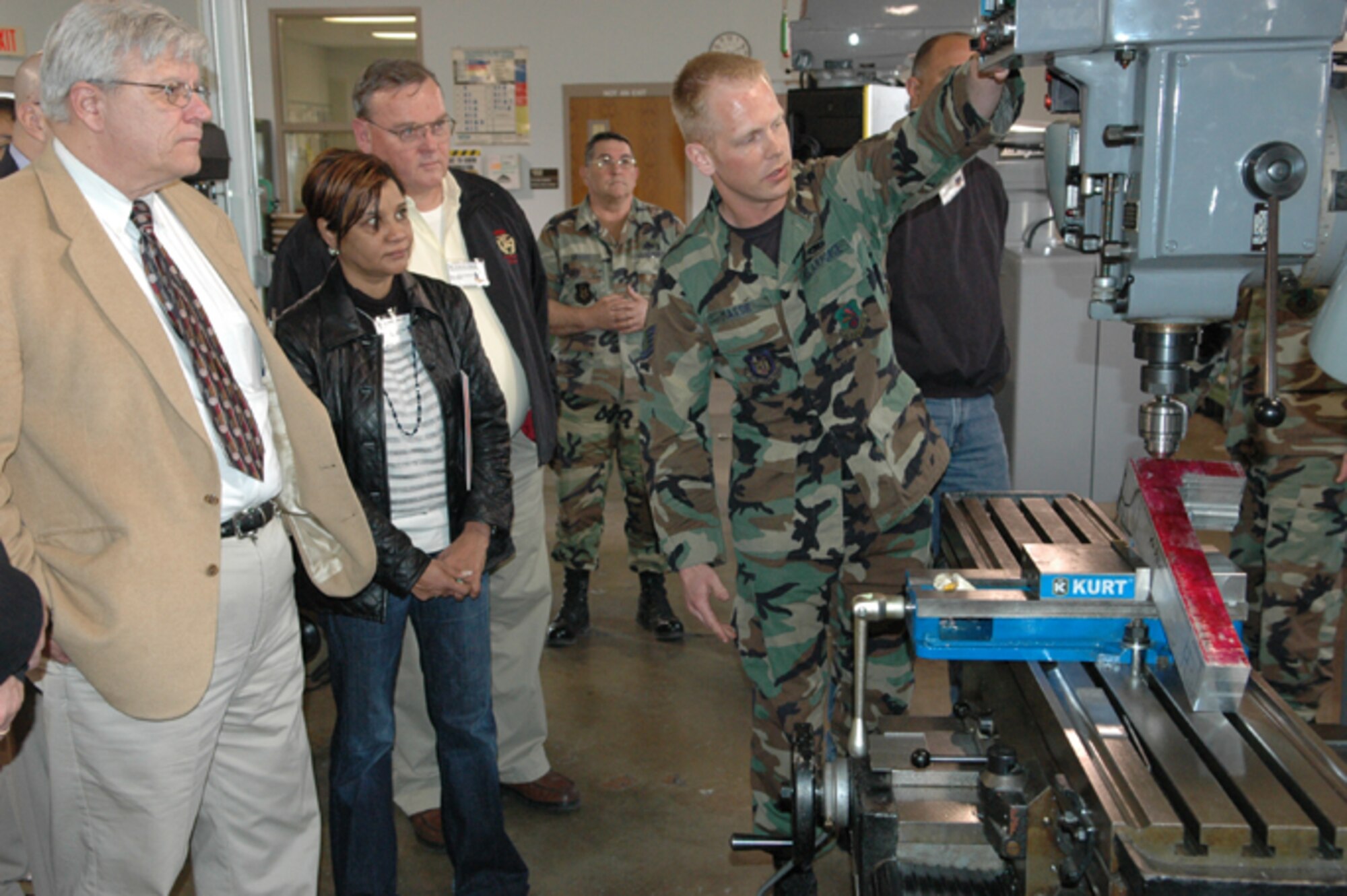 GRISSOM AIR RESERVE BASE, Ind., --  Staff Sgt. James Massie (right), a repair and reclamation specialist with the 434th Maintenance Squadron, shows Mike Fincher (far left), Nancy Jewell and Francis Jaquay, some of the machinery used by aircraft maintenance personnel.  A group of 29 civic leaders from throughout Indiana were hosted by the 434th Air Refueling Wing for a special two-day tour to enhance their awareness of various Department of Defense missions.  (U.S. Air Force photo/Senior Airman Carl Berry)