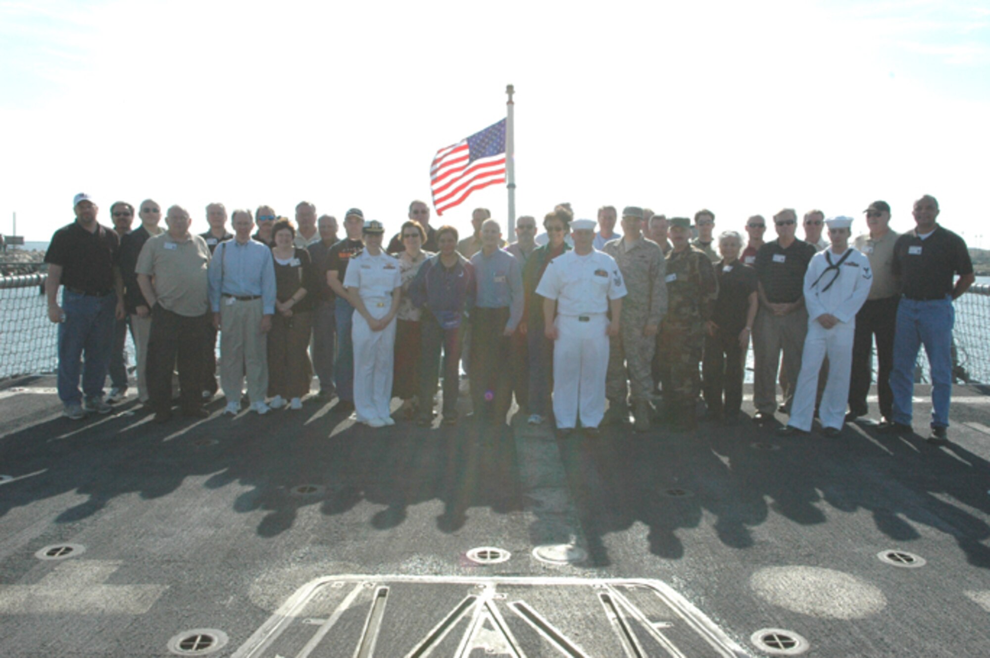 GRISSOM AIR FORCE BASE, Ind., --  Civic leaders from Indiana take time to pose for a group photo with sailors of the USS Dewert during a tour of Naval Station Mayport, Fla..  The USS Dewert's mission is to provide air, submarine, and surface protection for carrier battle groups, underway replenishment forces, amphibious groups, and convoys. (U.S. Air Force photo/Senior Airman Carl Berry)