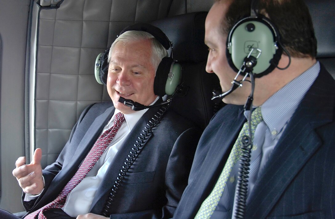 Defense Secretary Robert M. Gates, left, talks with Dan Fata, deputy assistant secretary of defense for European and NATO policy, aboard a U.S. Army UH-60 Blackhawk helicopter in Brussels, Belgium, Mar. 31, 2008.