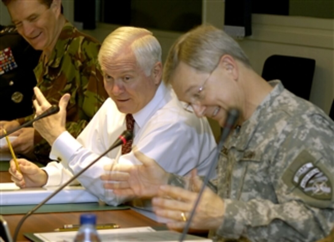 Defense Secretary Robert M. Gates, left, and U.S. Army Gen. John Craddock, NATO's supreme allied commander Europe, talk at Supreme Headquarters Allied Powers Europe in Mons, Belgium, March 31, 2008.