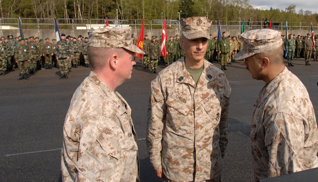 Sgt. Maj. Luigi Chiechi (center) stands at attention after his new sergeant major rank was pinned on in front of more than 35 nations during the opening ceremony of tactical exercise Combined Endeavor 2008. Chiechi is currently assigned to 6th Communications Battalion, 4th Marine Logistics Group, Marine Forces Reserve, based in Brooklyn, N.Y.