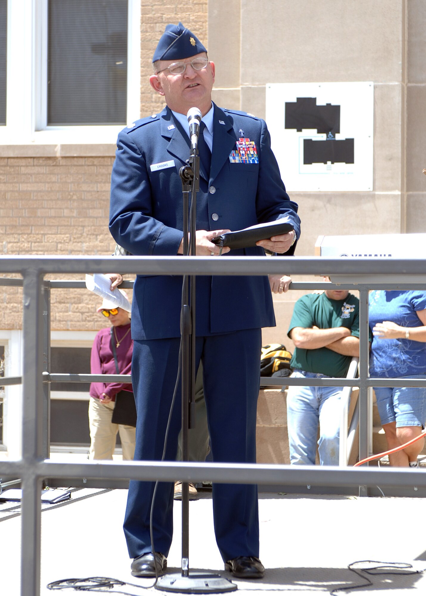 CANNON AIR FORCE BASE, N.M. - Ch. (Maj.) Kenneth Crooks, 27th Special Operations Wing chapel, reads an invocation in front of the Curry County courthouse May 1. The invocation was read in observance of National Prayer Day. (U.S. Air Force photo/Airman Basic Danielle Martin)