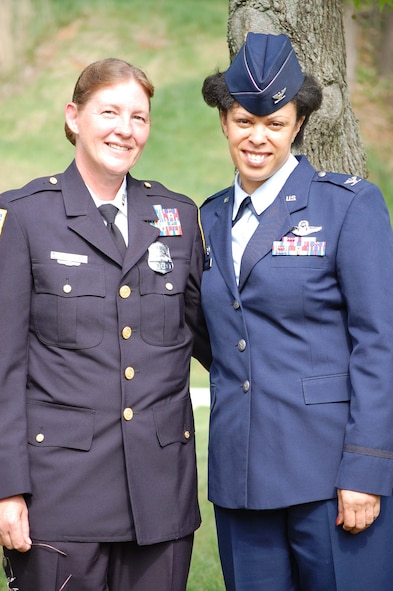 WASHINGTON, D.C. -- Tech. Sgt. Susan Mayer, 459th Military Equal Opportunity, poses at the Metropolitan Police Department graduation ceremony with Col. Stayce Harris, 459th Air Refueling Wing commander, April 25, 2008. Sergeant Mayer completed eight months of training April 11, as did Senior Master Sgt. Todd Cory (not shown), 459th Security Forces Squadron. Sergeant Mayer and Sergeant Corey are each 43. (Courtesy photo)