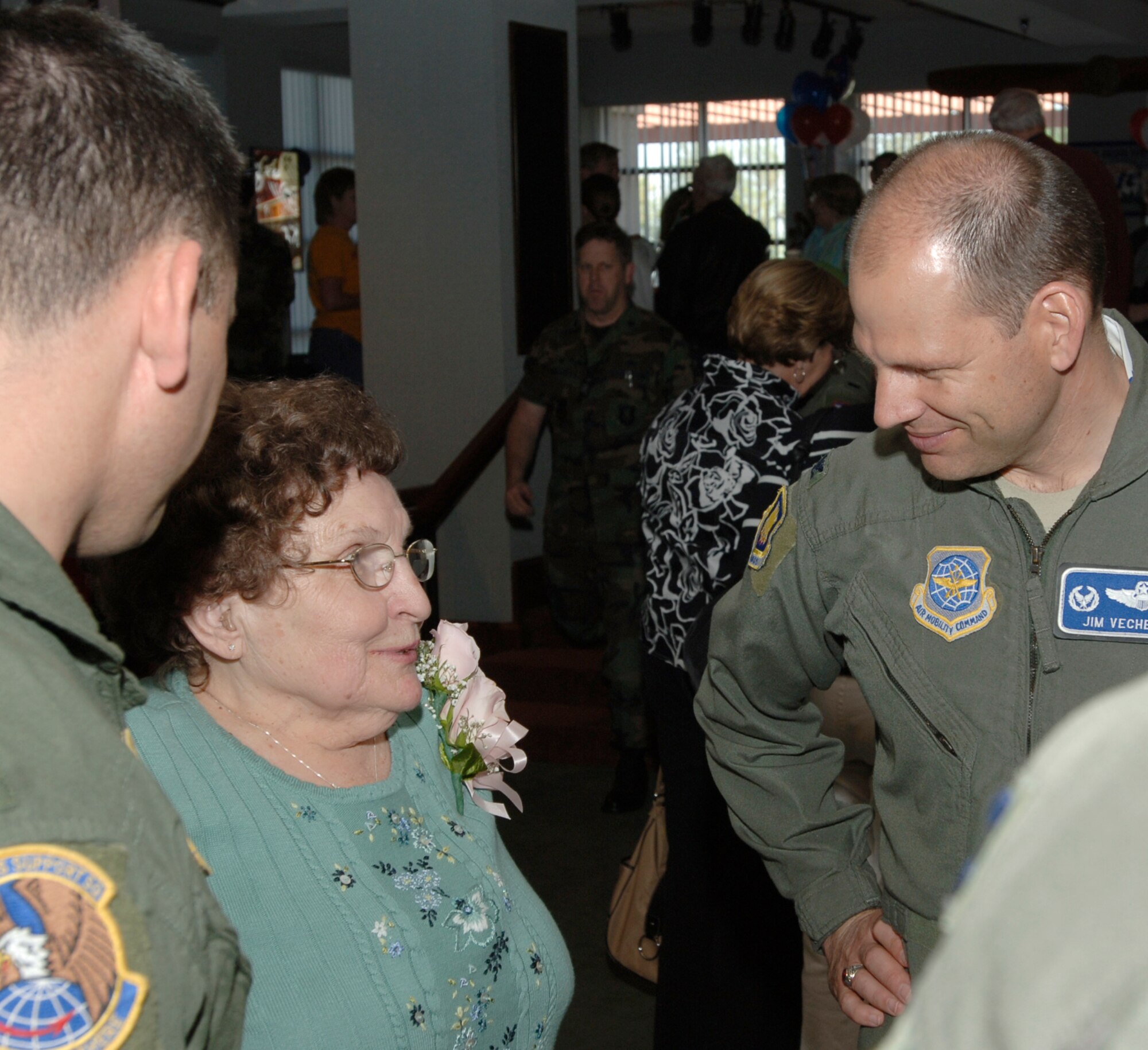 MCCONNELL AIR FORCE BASE, Kan. -- Elsie Fullerton speaks with Col. James Vechery, 22nd Air Refueling Wing commander, at Elsie’s retirement and birthday celebration at the Officer’s Club, April 25. Ms. Fullerton began working McConnell’s Officer’s Club on Feb. 1, 1959. (Photo by Senior Airman Roy Lynch III)