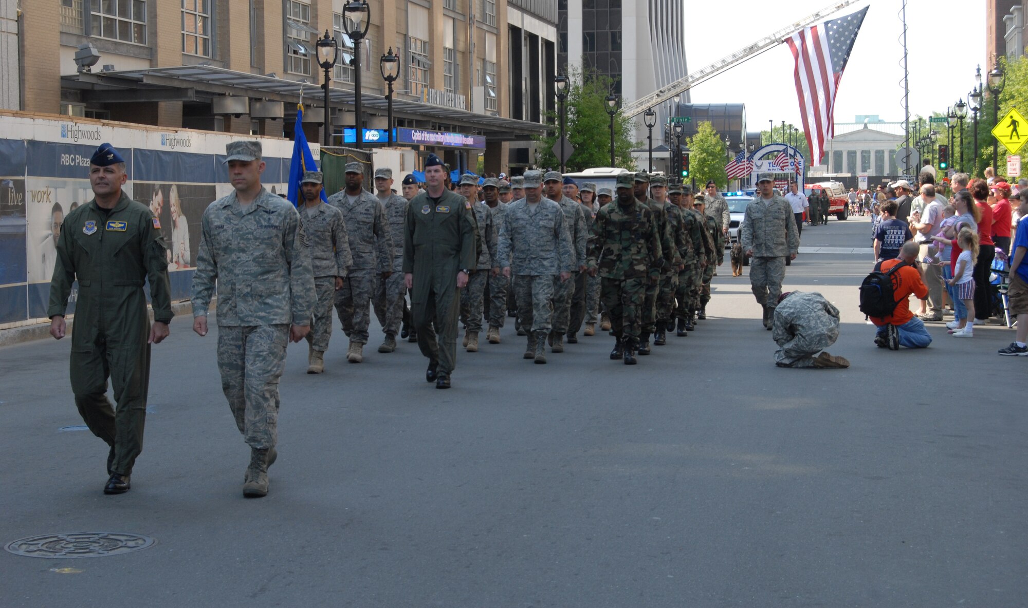 (Right) Col. John McDonald, 43rd Airlift Wing Vice Commander and 43rd AW Command Chief Master Sgt. Michael Grimm lead members of the 43rd AW in the parade Saturday morning in downtown Raleigh. (U.S. Air Force Photo by Ed Drohan)