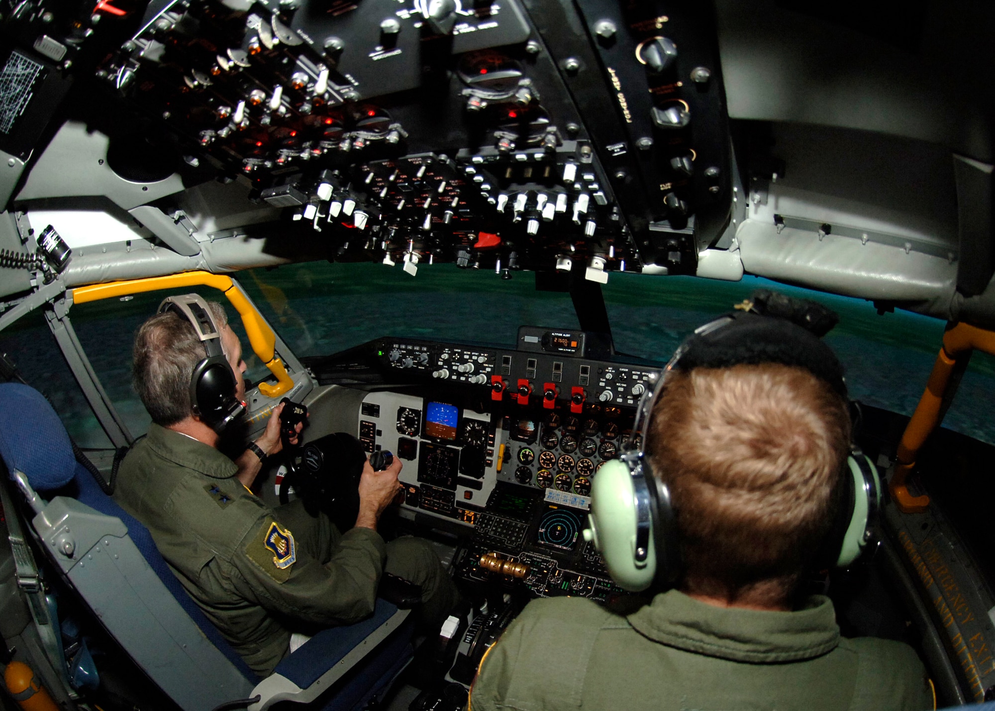 MCCONNELL AIR FORCE BASE, Kan. -- Maj. Gen. James Hawkins, Commander of the 18th Air Force, flies a simulated KC-135 alongside Maj. Bradford Anderson, 18th Air Refueling Squadron, April 30. Maj. Gen. Hawkins and Maj. Anderson practiced the pre-contact and contact aspects of air-to-air refueling. (Photo by Airman 1st Class Maria Ruiz)