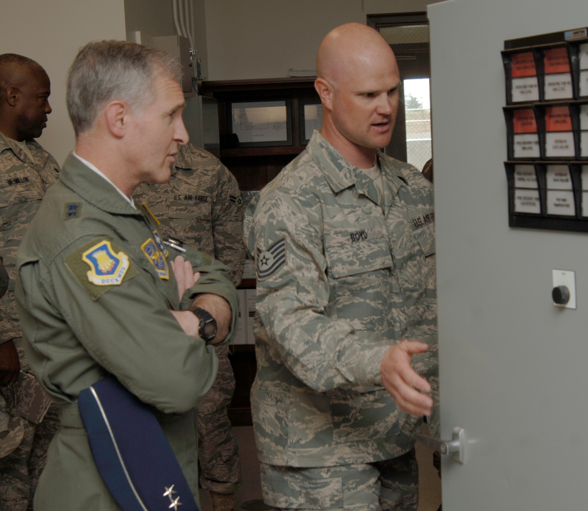 MCCONNELL AIR FORCE BASE, Kan. -- Tech. Sgt. Randal Boyd, 22 Logistic Readiness Squadron, briefs Maj. Gen. James A. Hawkins, 18th Air Force commander, on the new South hydrant. The new hydrant cost an estimated $17.2 million to construct.  (Photo by Senior Airman Roy Lynch III)