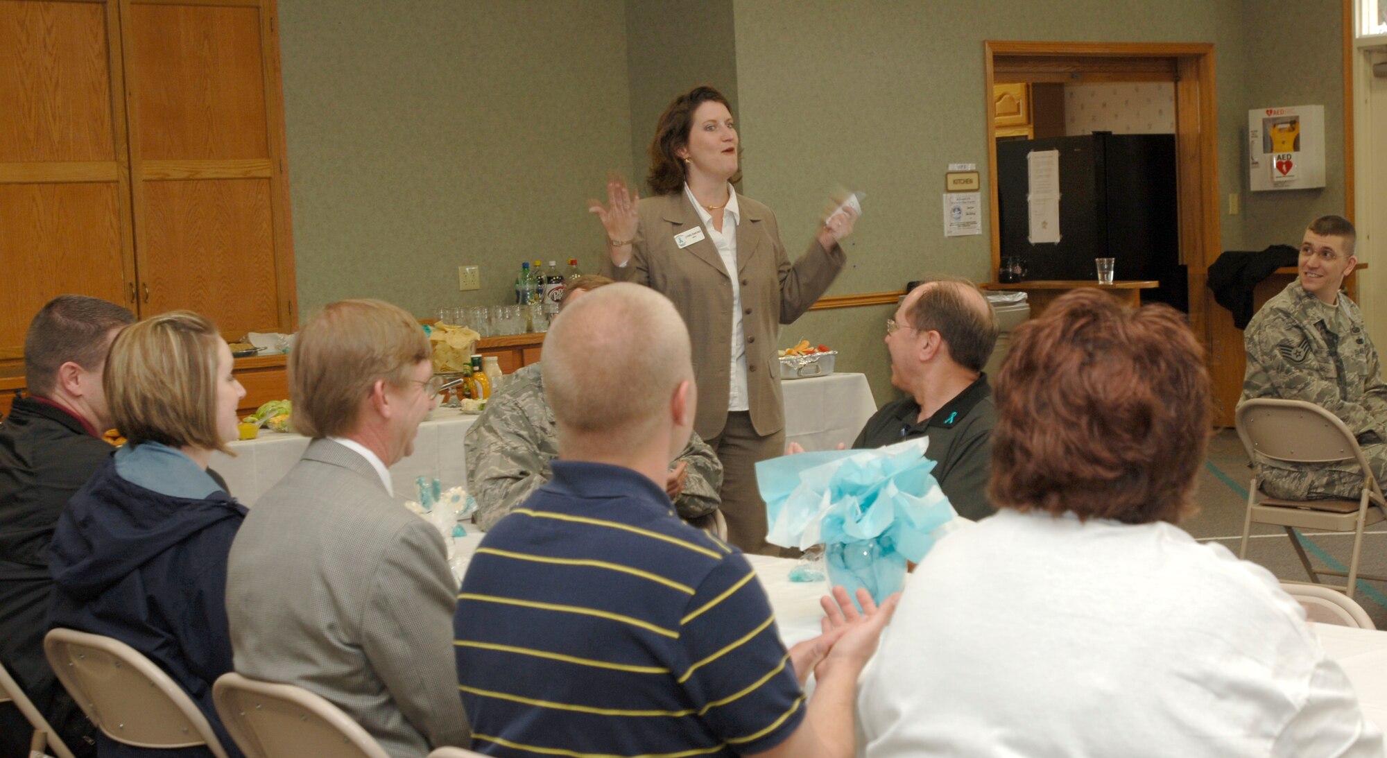 MCCONNELL AIR FORCE BASE, Kan. -- Lynn Emond, 22nd Air Refueling Wing, sexual assault response coordinator, speaks to team McConnell members at a Sexual Assault Awareness Month Appreciation luncheon at the Chapel Annex, April 25. The luncheon honored case management workers and victim advocates for their service to McConnell. (Photo by Senior Airman Roy Lynch III)