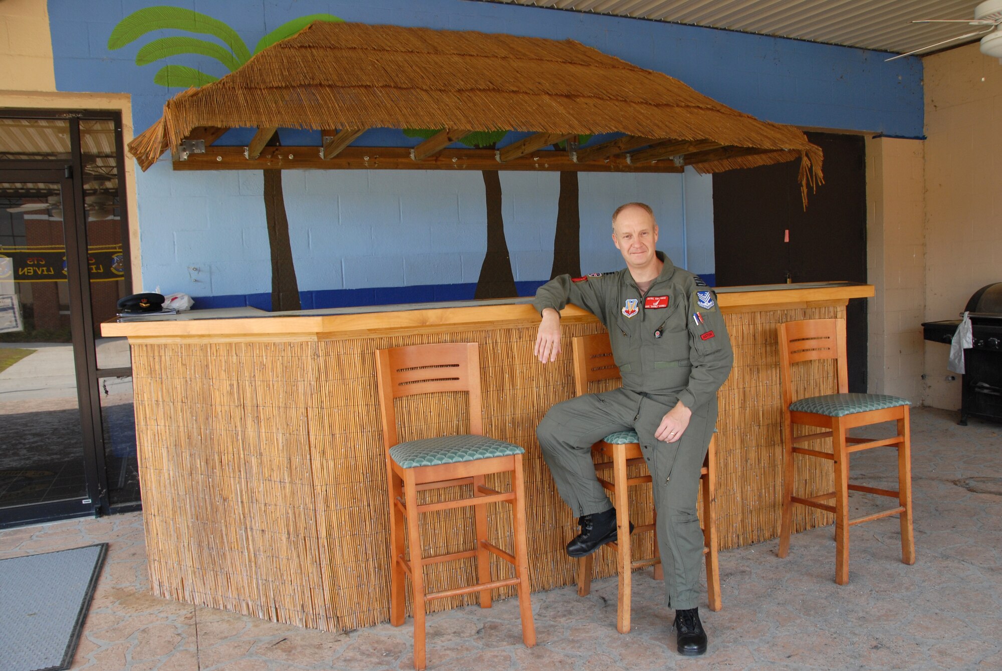 Squadron Leader David "Barney" Barnes enjoys the 330th Combat Training Squadron Tiki Lounge that he helped build. Sq. Ldr. Barnes is a foreign exchange officer from the United Kingdom assigned to the 116th Air Control Wing. Courtesy photo