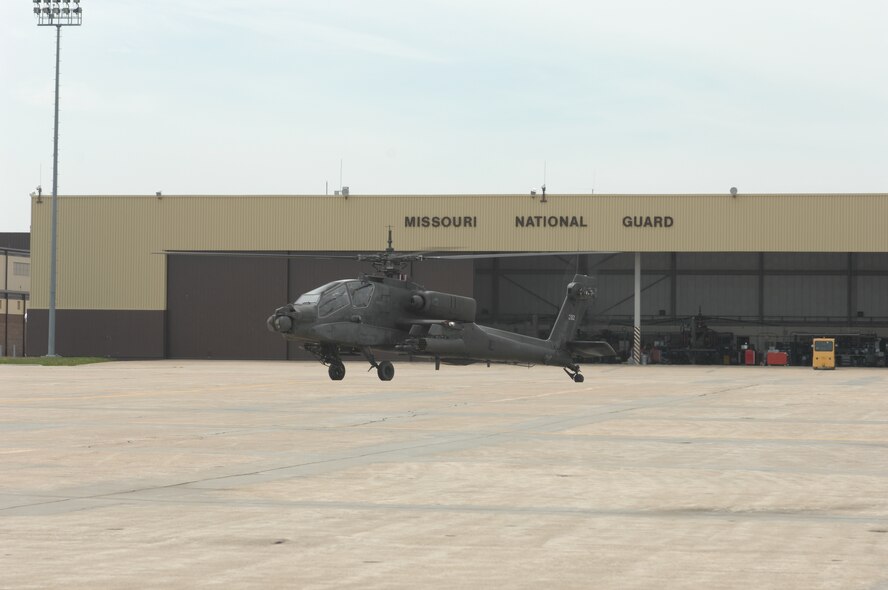 WHITEMAN AIR FORCE BASE, Mo. – Members of the 1-135th Attack Battalion, Army Lt. Col. Thomas Burson, AH-64A Apache pilot, and Warrant Officer 1 Zachary Barnes, co-pilot, taxi by a maintenance hangar on their way to the hover pad April 30. The AH-64A Apache from the 1-135th Attack Reconnaissance Battalion is part of the Missouri Army National Guard sharing Whiteman’s ramp. (U.S. Air Force photo/Tech. Sgt. Samuel A. Park) 