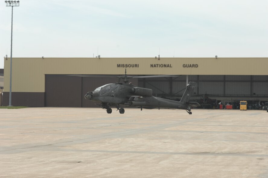 WHITEMAN AIR FORCE BASE, Mo. – Members of the 1-135th Attack Battalion, Army Lt. Col. Thomas Burson, AH-64A Apache pilot, and Warrant Officer 1 Zachary Barnes, co-pilot, taxi by a maintenance hangar on their way to the hover pad April 30. The AH-64A Apache from the 1-135th Attack Reconnaissance Battalion is part of the Missouri Army National Guard sharing Whiteman’s ramp. (U.S. Air Force photo/Tech. Sgt. Samuel A. Park)