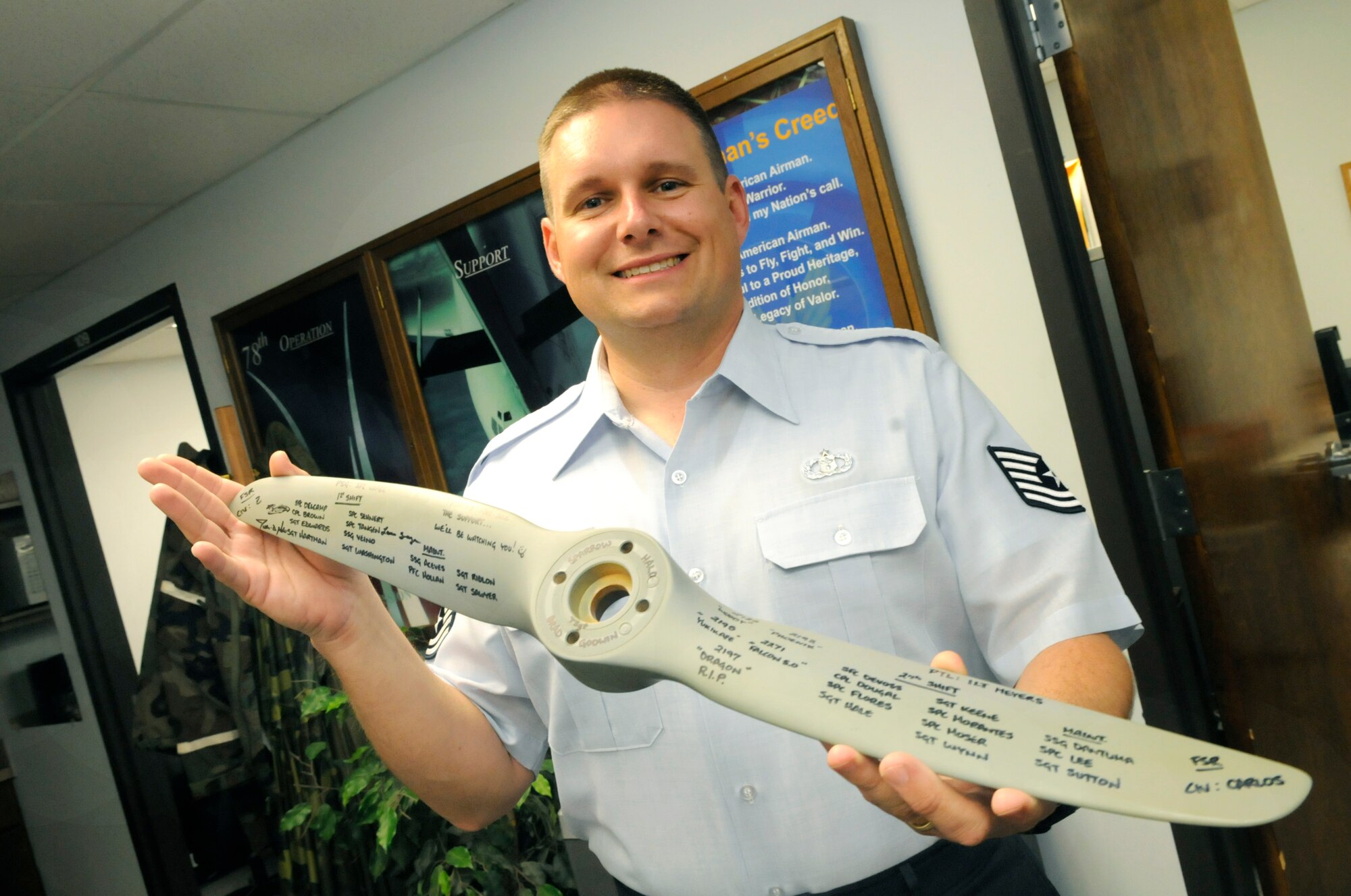 TSgt. Brad Godwin holds a propeller from a Shadow unmanned aerial vehicle. He did weather briefings for these vehicles while in Kirkuk, Iraq. U. S. Air Force photo by Sue Sapp