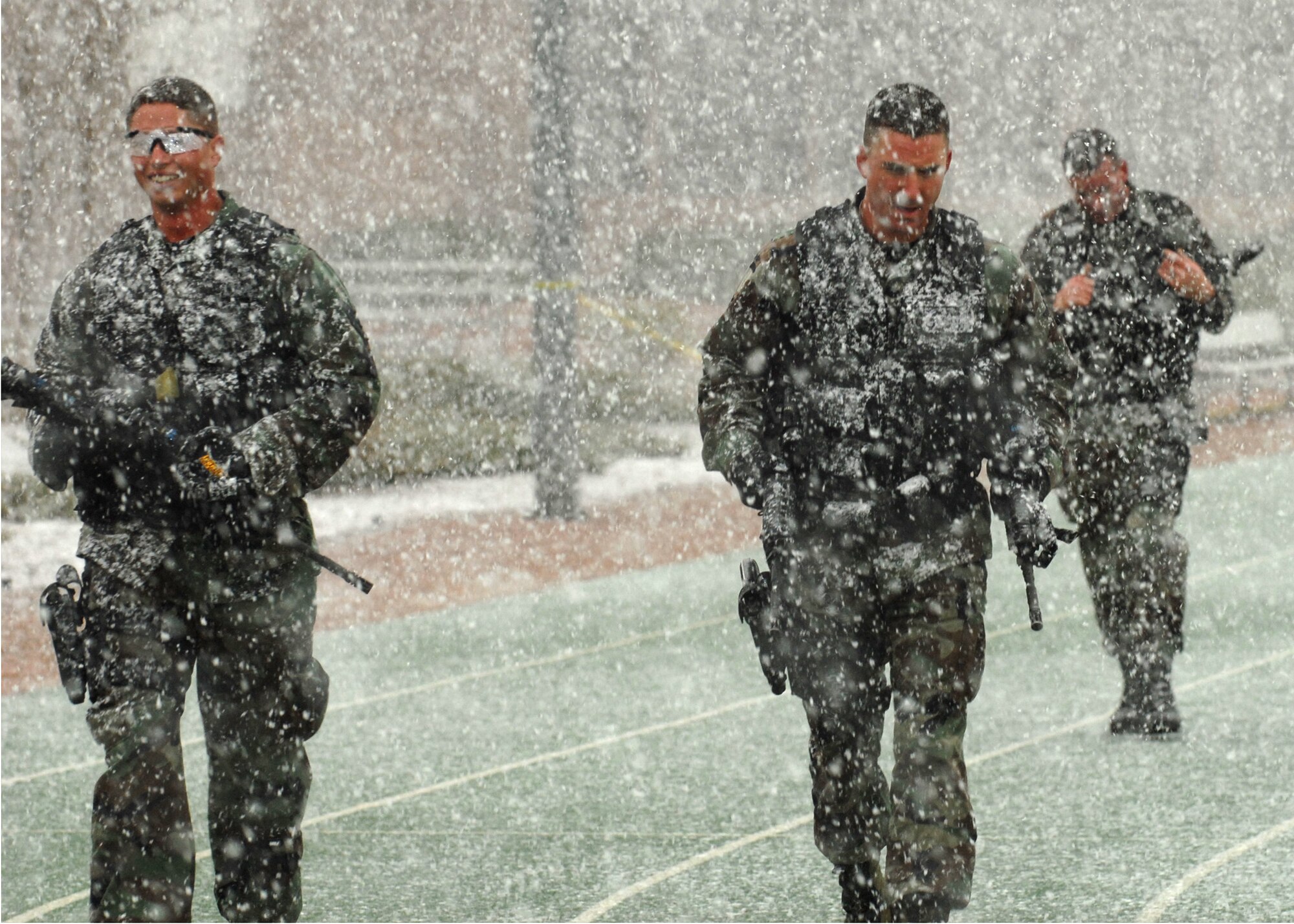 Staff Sgt. Aaron Trujillo, Senior Airman Matthew Masciorini, and Tech. Sgt. Duane Blackmon, Buckley’s Security Forces Guardian Challenge team, demonstrate their endurance during the 2008 Guardian Challenge held at Peterson Air Force Base. (U.S. Air Force photo by Airman First Class Randi Flaugh)