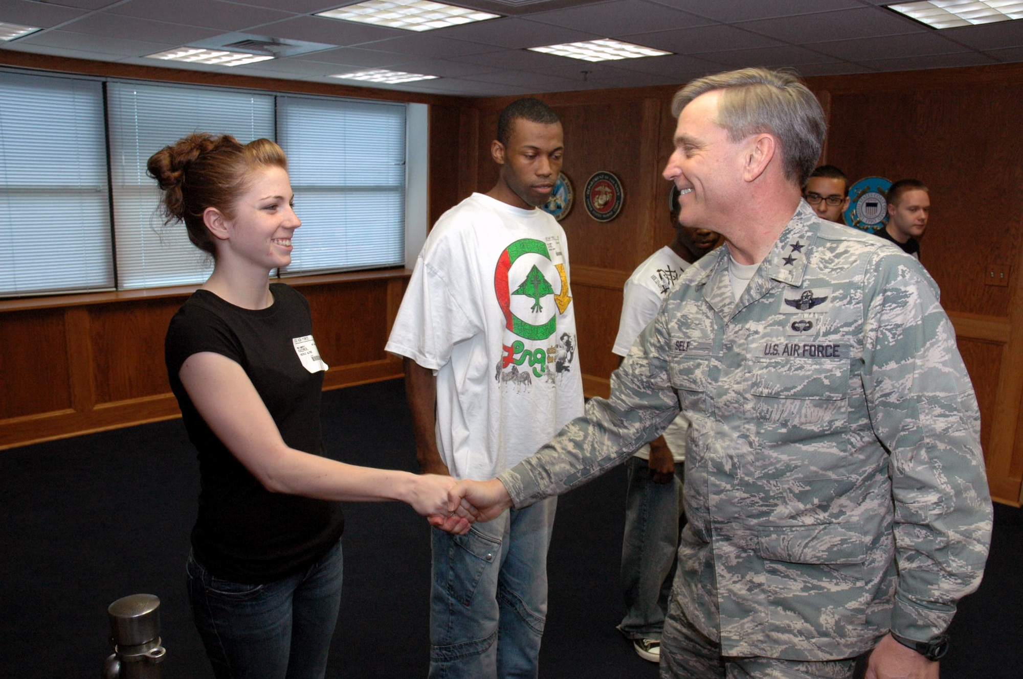 Maj. Gen. Kip Self, U.S. Air Force Expeditionary Center commander, congratulates Nicole Kazimer after she completed the oath of enlistment along with four other new Air Force enlistees at the Fort Dix Military Entrance Processing Station April 29, 2008, on Fort Dix, N.J.  General Self took the opportunity to do the enlistment oath because Ms. Kazimer is the daughter of Master Sgt. Joe Kazimer of the Center's 421st Combat Training Squadron and Tech. Sgt. Karyn Kazimer of the 108th Air Refueling Wing, McGuire Air Force Base, N.J.  (U.S. Air Force Photo/Tech. Sgt. Scott T. Sturkol)