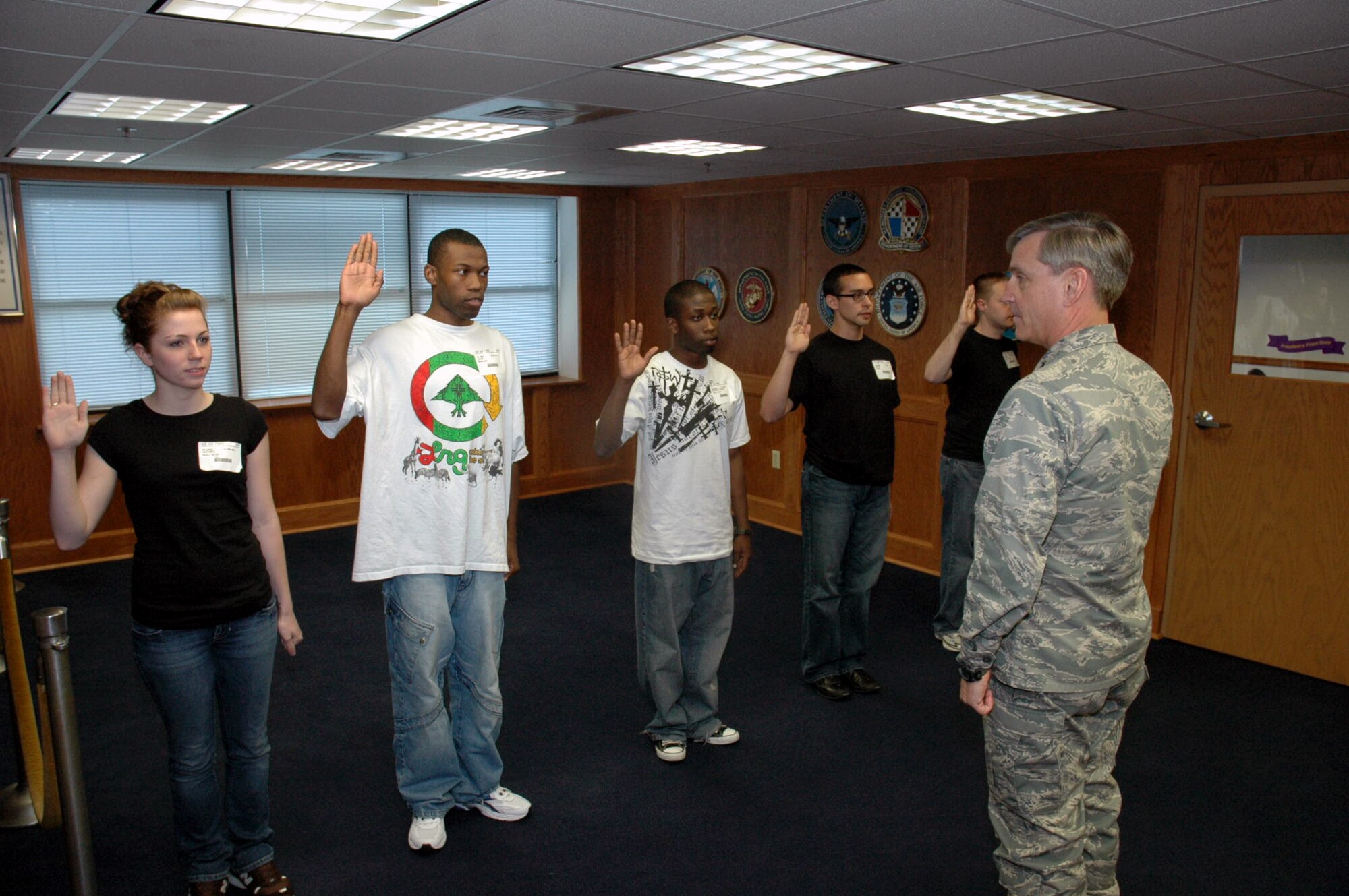 Maj. Gen. Kip Self, U.S. Air Force Expeditionary Center commander, administers the oath of enlistment to five new Air Force enlistees at the Fort Dix Military Entrance Processing Station April 29, 2008, on Fort Dix, N.J.  General Self took the opportunity to do the enlistment oath because one of the enlistees, Nicole Kazimer, is the daughter of Master Sgt. Joe Kazimer of the Center's 421st Combat Training Squadron and Tech. Sgt. Karyn Kazimer of the 108th Air Refueling Wing, McGuire Air Force Base, N.J.  (U.S. Air Force Photo/Tech. Sgt. Scott T. Sturkol)