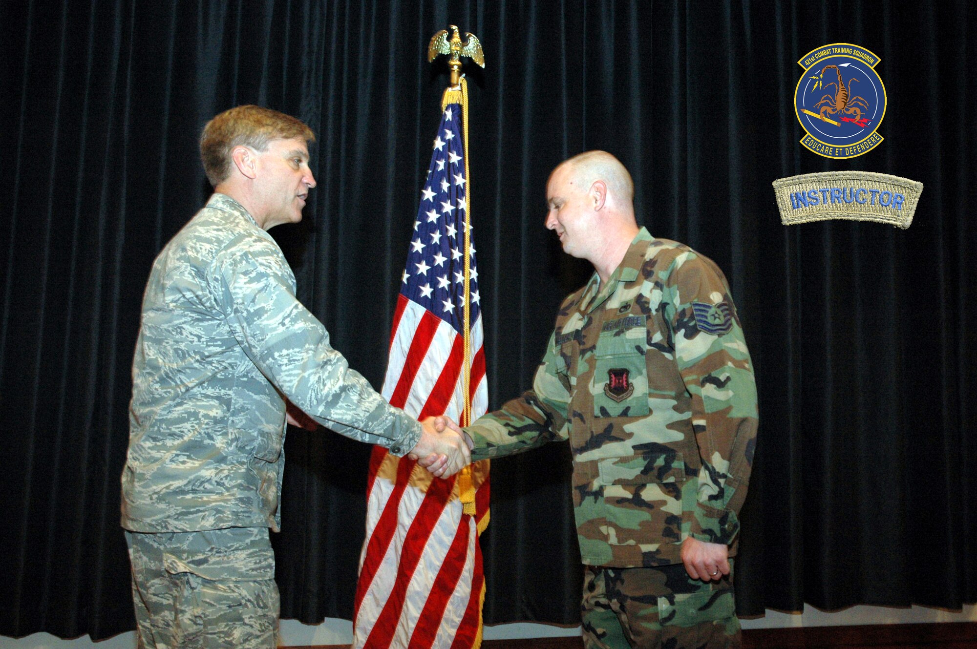 Maj. Gen. Kip Self, U.S. Air Force Expeditionary Center commander, presents the instructor tab to Tech. Sgt. Scott Mueller of the 421st Combat Training Squadron April 29, 2008, inside the Center on Fort Dix, N.J.  Sergeant Muelller was the first to receive the instructor tab under the squadron's new training program for new instructors.  (U.S. Air Force Photo Illustration/Tech. Sgt. Scott Sturkol and Staff Sgt. Paul Evans)