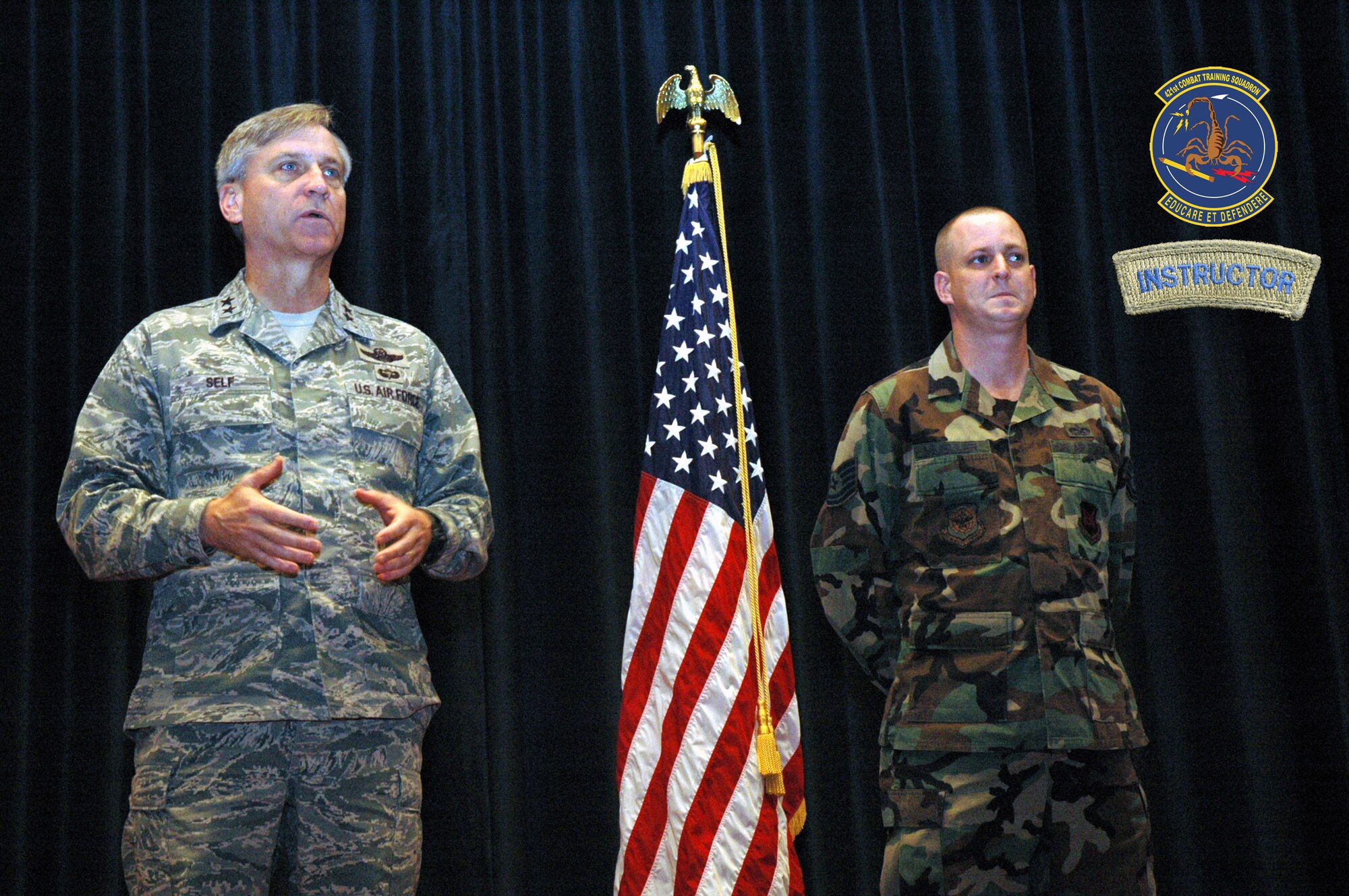 Maj. Gen. Kip Self, U.S. Air Force Expeditionary Center commander, talks to members of the 421st Combat Training Squadron as part of a presentation of the instructor tab to Tech. Sgt. Scott Mueller of the 421st April 29, 2008, inside the Center on Fort Dix, N.J.  Sergeant Muelller was the first to receive the instructor tab under the squadron's new training program for new instructors.  (U.S. Air Force Photo Illustration/Tech. Sgt. Scott Sturkol and Staff Sgt. Paul Evans)