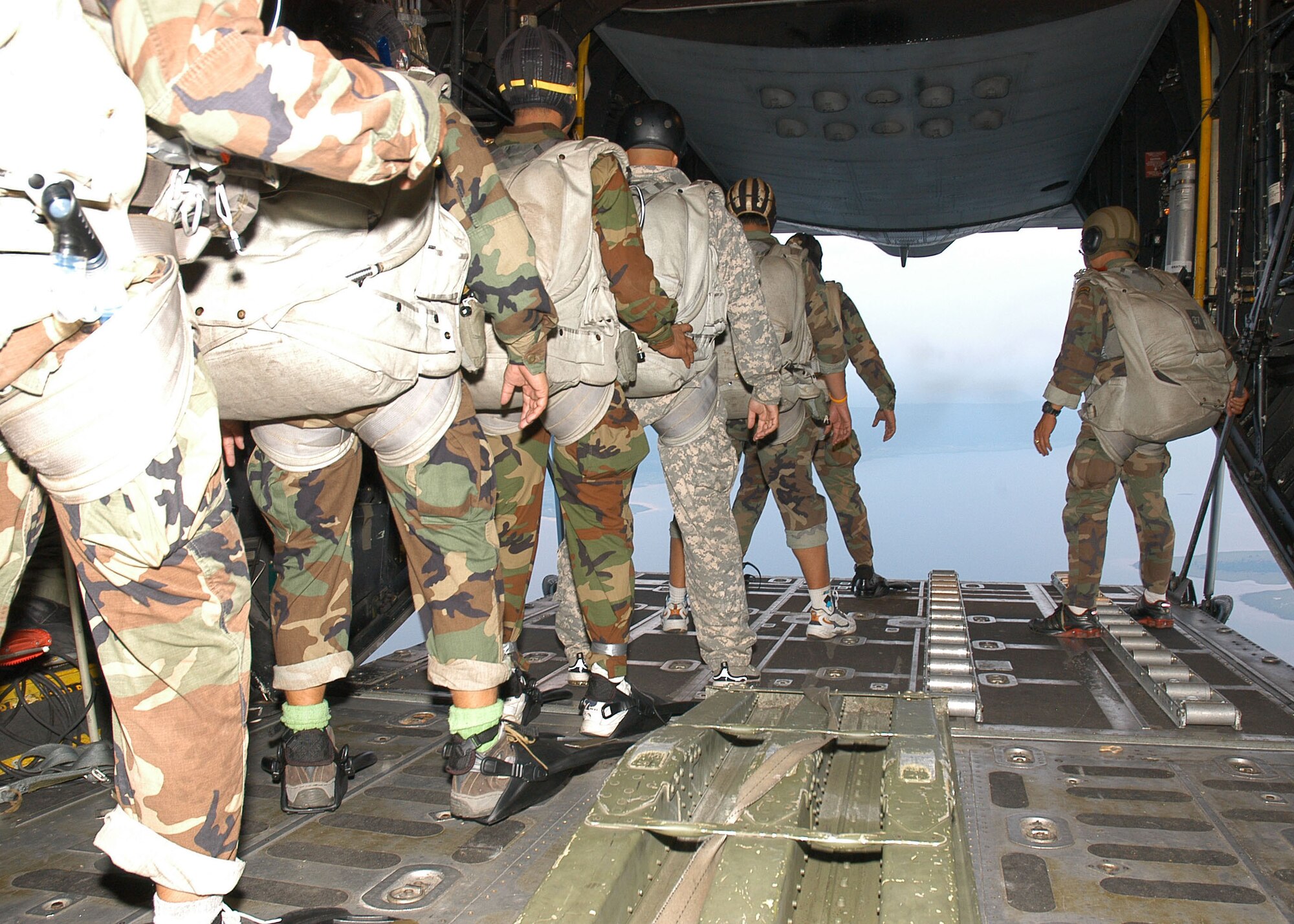 Special forces from the Royal Thai Air Force prepare to jump from an MC-130P Combat Shadow during Exercise Teak Torch.  The Thai troops and 353rd Special Operations Group members exercised together as part of Pacific Command's joint combined exchange training. (U.S. Air Force photo/Master Sgt. Marilyn Holliday)                           