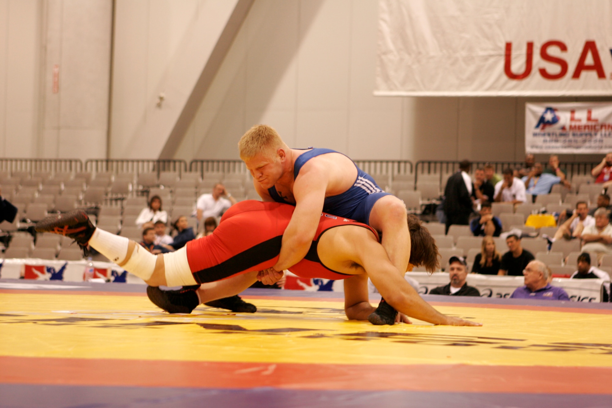 LAS VEGAS—Air Force wrestler Senior Airman Justin Millard (blue) secures his grip on Rob Smith, New York Athletic Club, during fifth-round competition of the senior men’s Greco tournament, 96 kilos, during the 2008 U.S. National Wrestling Championships April 25 at the Las Vegas Convention Center. Airman Millard placed 5th in his weight class, assisting the Air Force team in taking home three overall place wins. (U.S. Air Force photo/Staff Sgt. Jacob R. McCarthy)