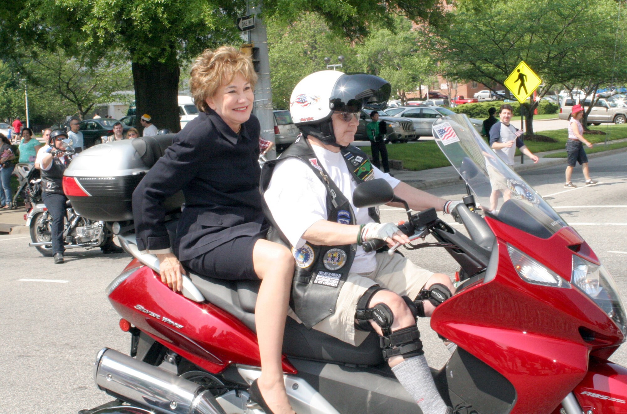 RALEIGH, N.C. - Senator Dole rides in the Salute the Troops Parade through the streets of downtown Raleigh with one of more than 50 Rolling Thunder members April 26. More than 50,000 spectators attended the military appreciation event that featured every branch of the military in a parade followed by family-friendly entertainment. The initiative was supported by local, state, and national industries and companies.  Rolling Thunder is a private veteran?s association promoting awareness for prisoners of war and soldiers missing in action.  (US Air Force Photo by Capt Tana R.H. Stevenson)