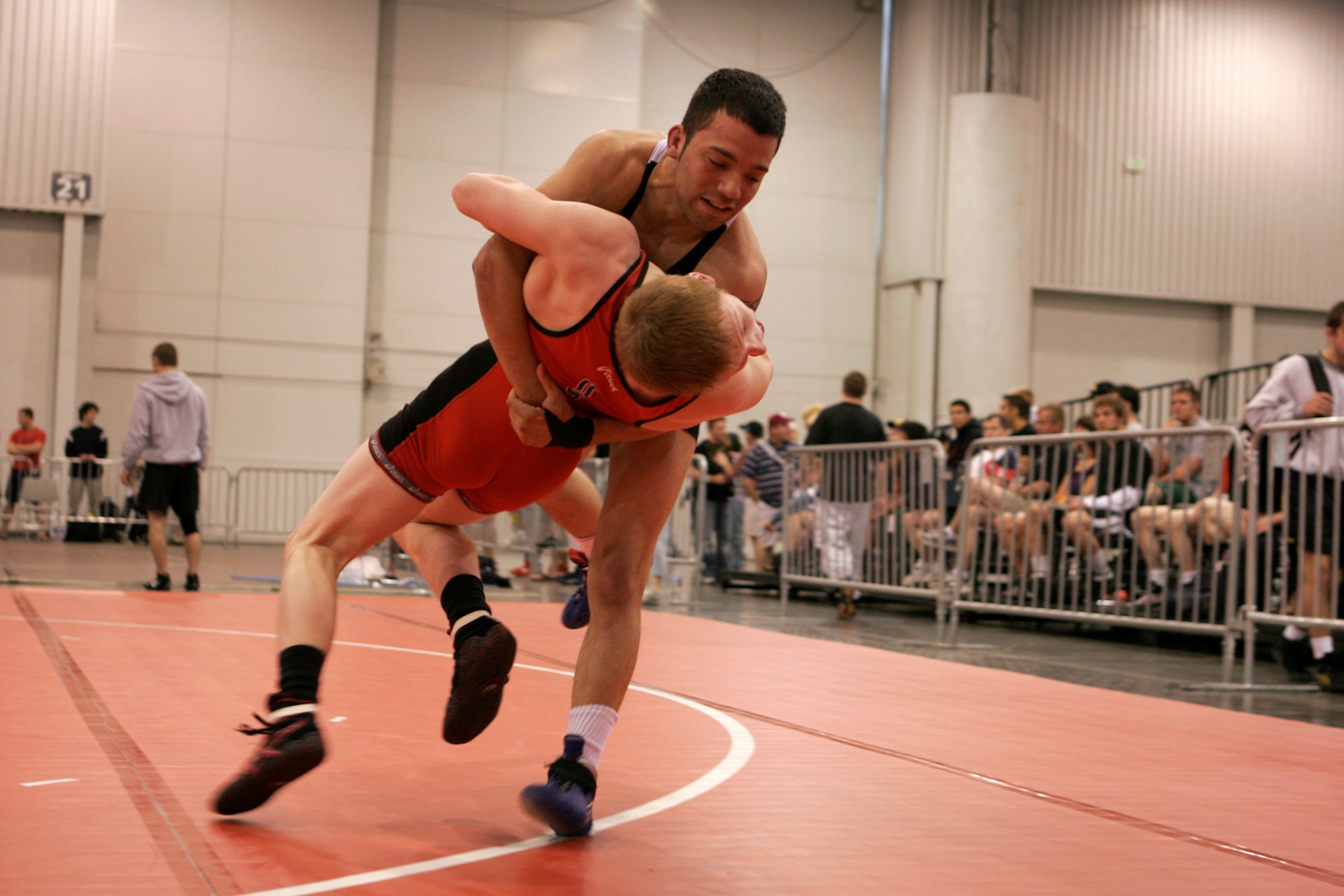 LAS VEGAS-- Air Force wrestler Senior Airman (blue) throws his opponent, Paul Tellgreen, Minnesota Storm wrestling club, out of bounds in round-three competition of the senior men’s Greco tournament, 55 kilos, during the 2008 U.S. National Wrestling Championships April 25 at the Las Vegas Convention Center. Airman Perez placed 8th in his weight class, assisting the Air Force team in taking home three overall place wins. (U.S. Air Force photo/Staff Sgt. Jacob R. McCarthy)