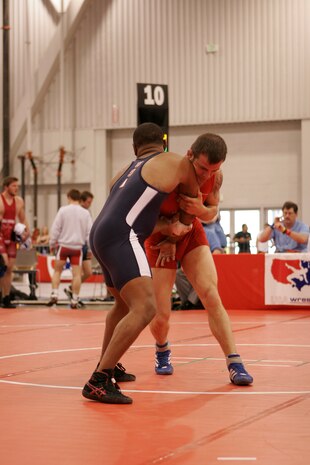 LAS VEGAS—Air Force wrestler Staff Sgt. Jacob Hey (red) secures an arm hold against his opponent, Shannon Slack, New York Athletic Club, in round-three competition of the senior men’s Greco tournament, 66 kilos, during the 2008 U.S. National Wrestling Championships April 25 at the Las Vegas Convention Center. Sergeant Hey placed 5th in his weight class, assisting the Air Force team in taking home three overall place wins. (U.S. Air Force photo/Staff Sgt. Jacob R. McCarthy)