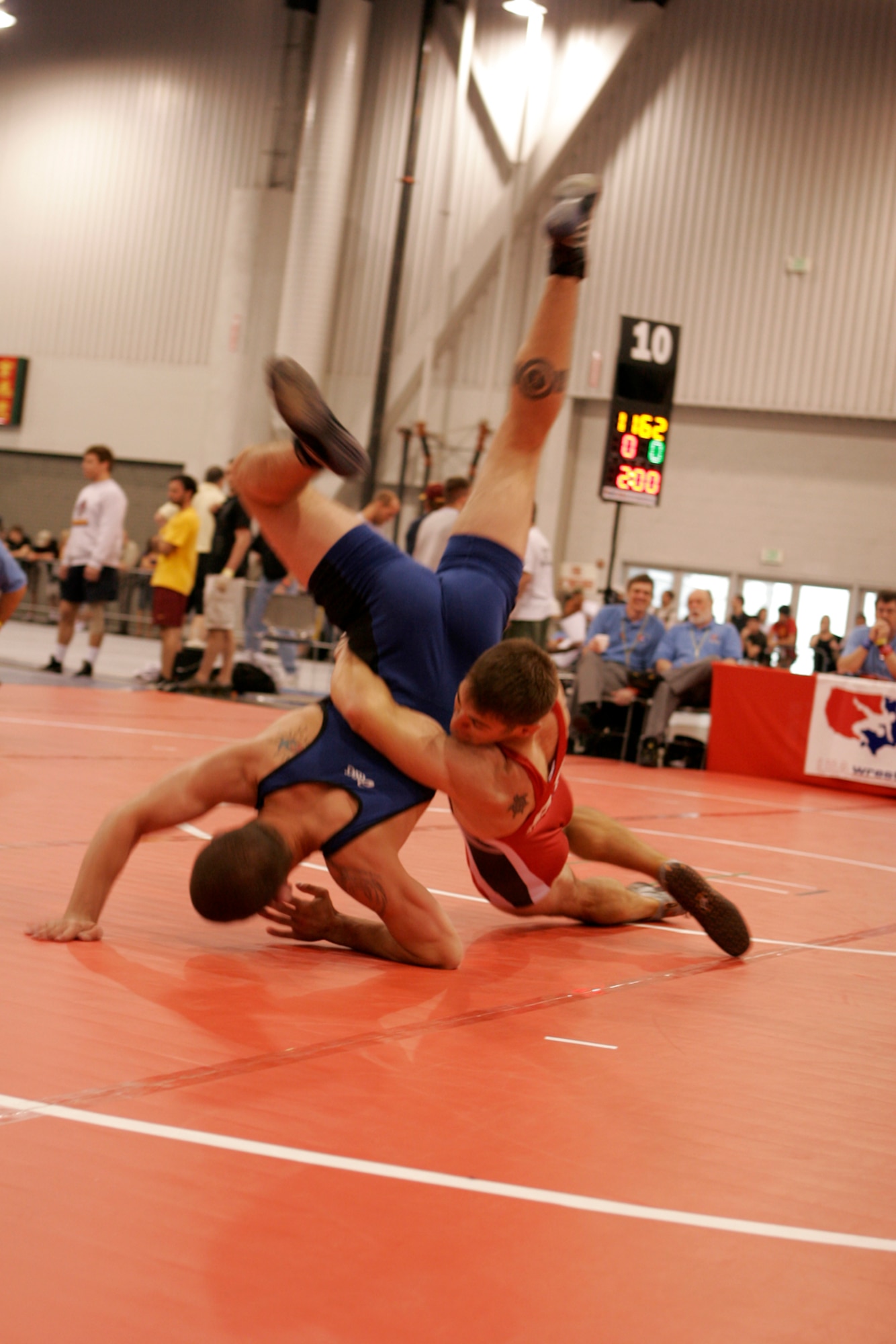 LAS VEGAS—Air Force wrestler Staff Sgt. Gabe Schaefer (red) slams his opponent, Nic Remer, Navy wrestling, for a three-point score in second-round competition of the senior men’s Greco tournament, 66 kilos, during the 2008 U.S. National Wrestling Championships April 25 at the Las Vegas Convention Center. The Air Force wrestling team finished the tournament with three overall place wins. (U.S. Air Force photo/Staff Sgt. Jacob R. McCarthy) 