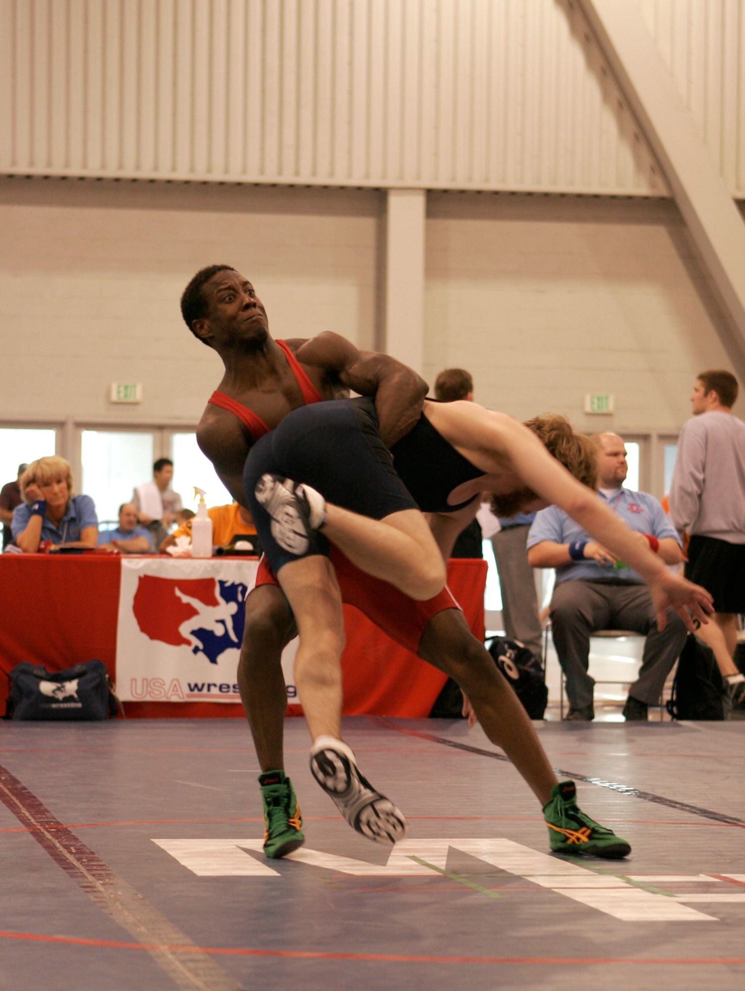 LAS VEGAS—Air Force wrestler Capt. Anthony Brooker (red) hoists up Eric Stevenson, Orange Crush wrestling club, before scoring a two-point toss in second-round competition of the senior men’s Greco tournament, 60 kilos, during the 2008 U.S. National Wrestling Championships April 25 at the Las Vegas Convention Center. The Air Force wrestling team finished the tournament with three overall place wins. (U.S. Air Force photo/Staff Sgt. Jacob R. McCarthy) 