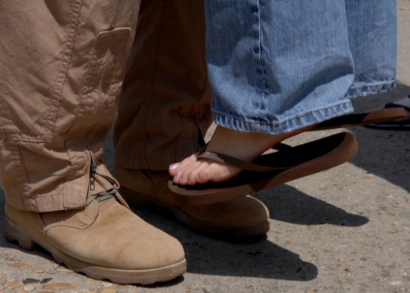 MOODY AIR FORCE BASE, Ga. -- An Airman of the 823rd Security Forces Squadron lifts a loved one from the ground during a hug here April 29. The 823rd SFS was returning from a six-month deployment to Camp Bucca, Iraq. (U.S. Air Force photo by Airman 1st Class Brittany Barker) 