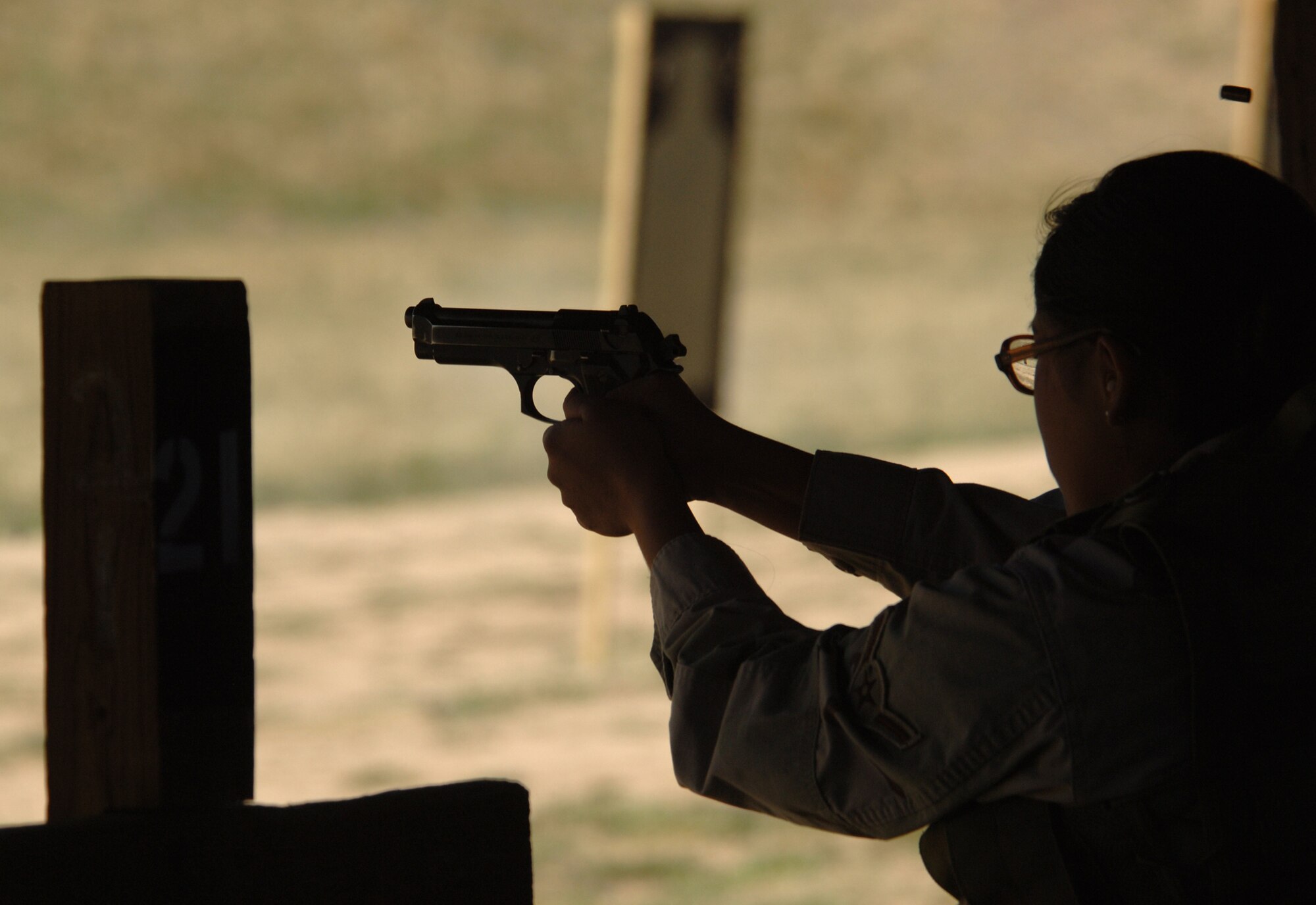 A 9 mm pistol shell ejects over the head of Airman Stacy John, 721st Security Forces Squadron member, during the Guardian Challenge Marksmanship Competition April 30 at the U.S. Air Force Academy range in Colorado. Security forces members will wrap up their competitions May 2 in Jacks Valley at the Academy. The Guardian Challenge banquet to announce the winners of this year’s competition will be held May 9 at Peterson Air Force Base, Colo. (U.S. Air Force photo/Master Sgt. Matt Gilreath)
