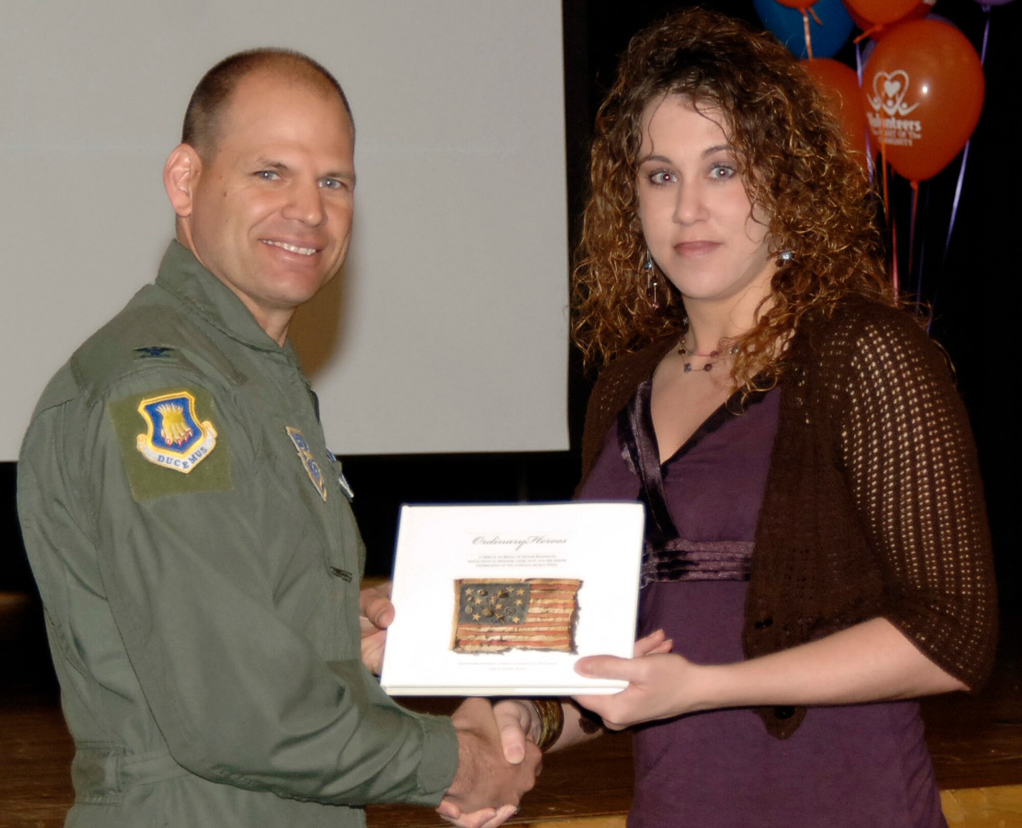 Tech. Sgt. Rachel Forrest recently received a Military Volunteer Service Medal from Col. James Vechery, 22nd Air Refueling Wing Commander, during a ceremony at McConnell Air Force Base, Kan. Sergeant Forrest is a new Family Readiness technician for the 931st Air Refueling Group.  She was nominated to receive the medal for her work with the McConnell Drug Education For Youth program while on active duty with the 22nd ARW. (Courtesy Photo)