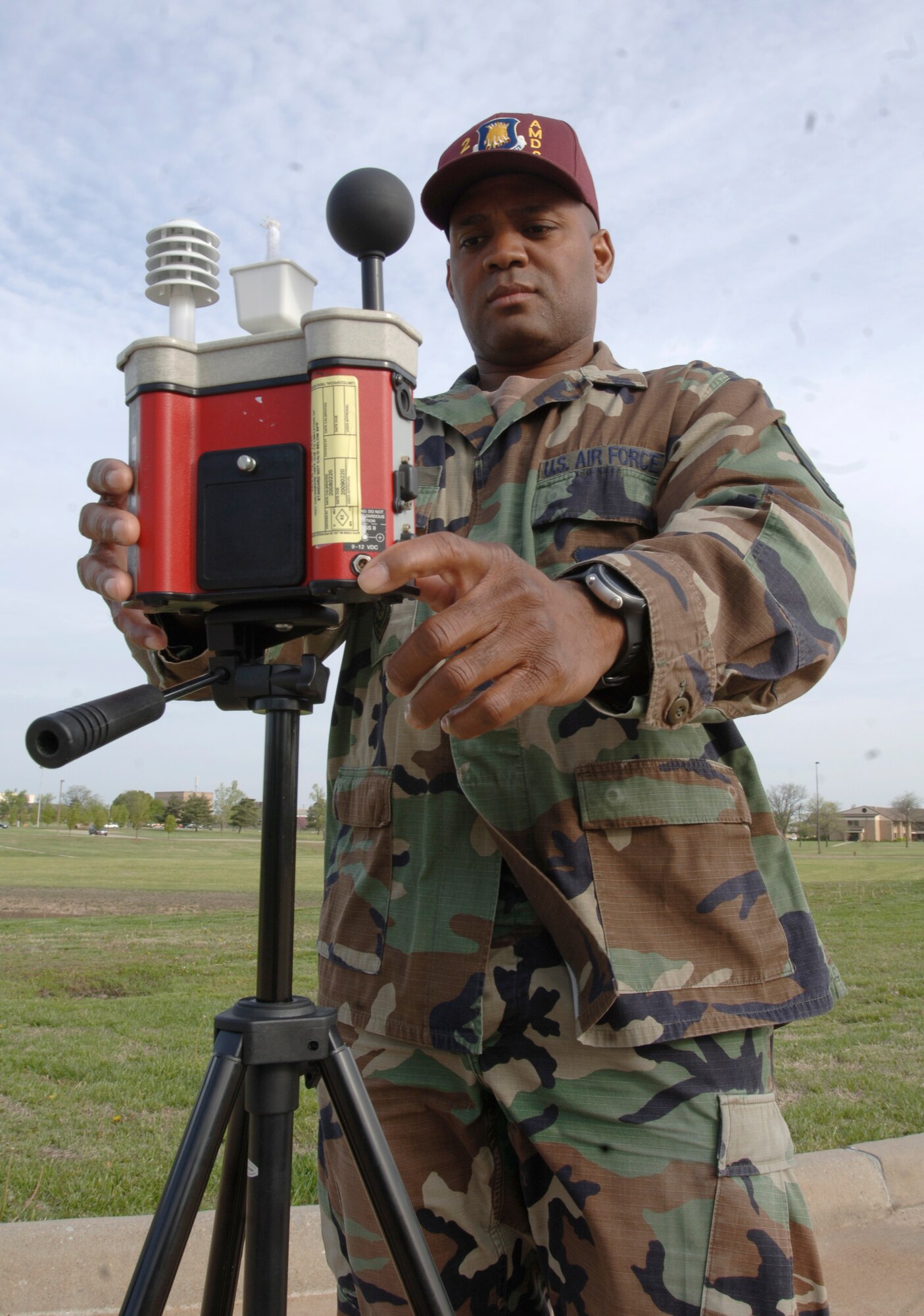 MCCONNELL AIR FORCE BASE, Kan. -- Master Sgt. Michael Keys, 22nd Aerospace Medicine Squadron, sets up a Wet Bulb Globe Temperature at the clinic, April 29. Wet Bulb Globe Temperature is used to detect the temperature and moister of an area to see what effects that area could have on the body. (Photo by Senior Airman Roy Lynch III)
