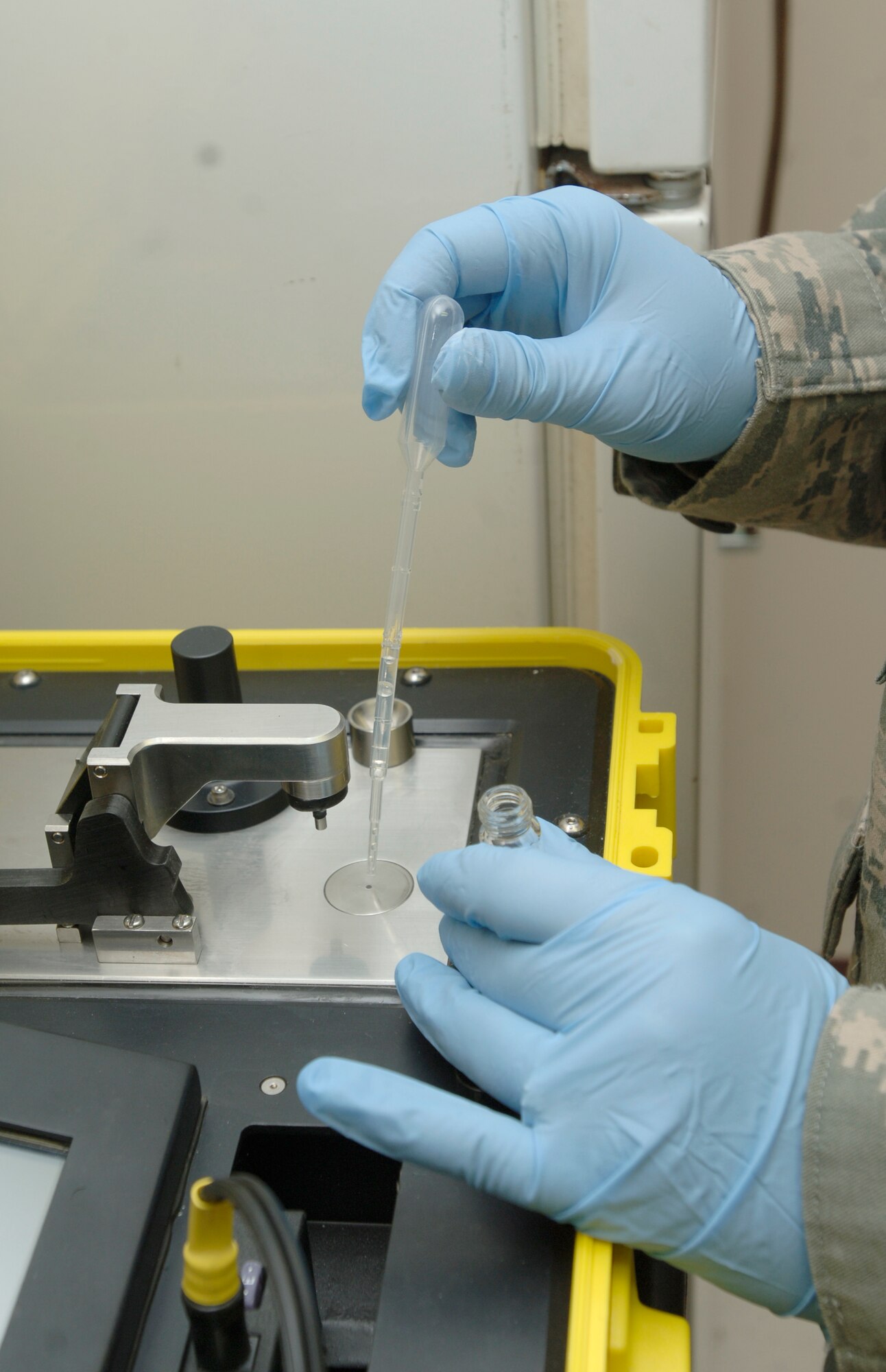 MCCONNELL AIR FORCE BASE, Kan. -- Staff Sgt. Lisa Liddell, 22nd Aerospace Medicine Squadron, testing a sample on a Hazmat ID System at the clinic, April 29. Hazmat ID System identifies solid and liquid chemical compounds.  (Photo by Senior Airman Roy Lynch III)