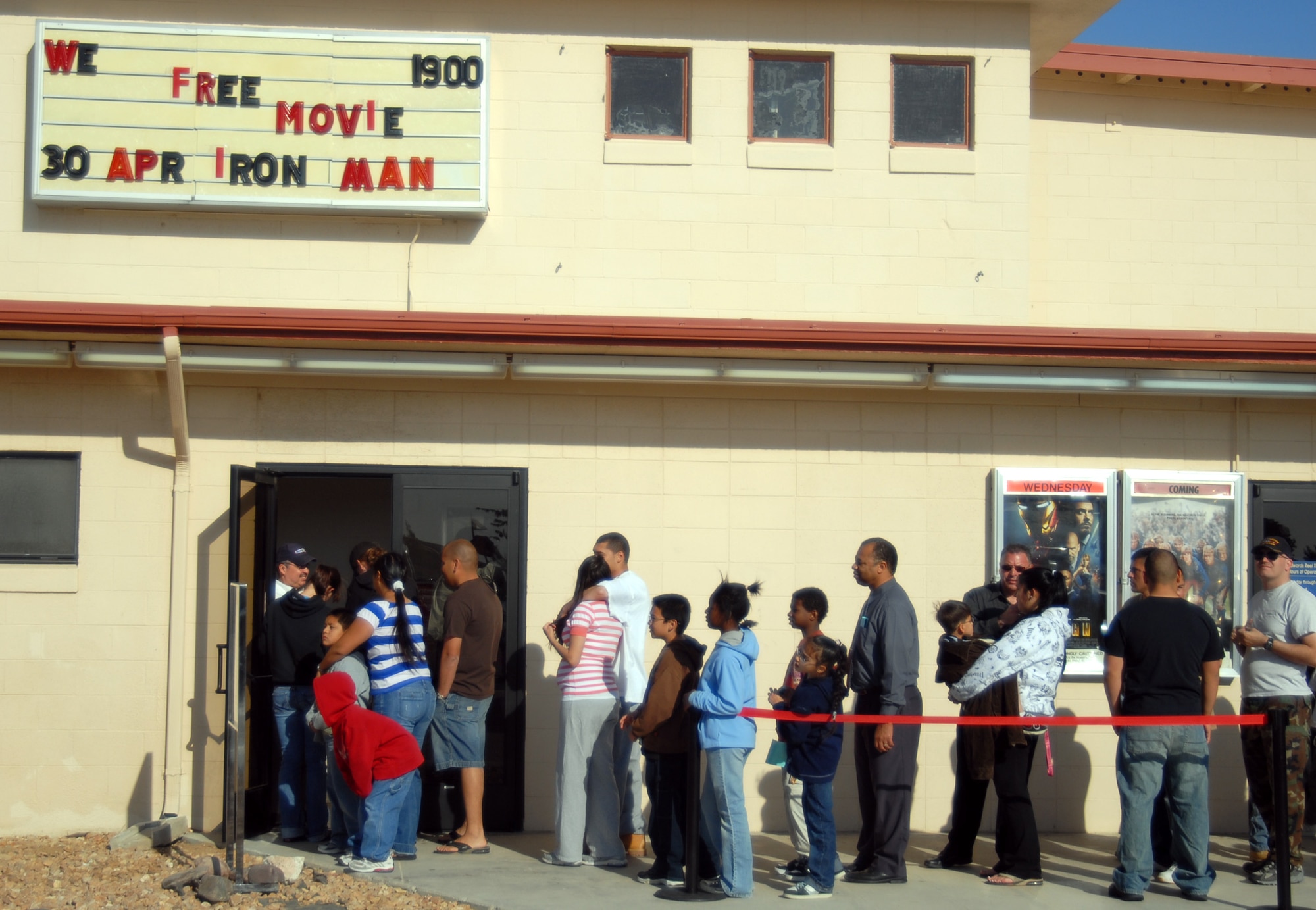 Edwards moviegoers wait in line for a free screening of the movie "Iron Man" at the Reel Time Theater here April 30. "Iron Man," which stars Robert Downey Jr, Terrence Howard and Gwyneth Paltrow, filmed several scenes at Edwards in April 2007. (Air Force photo by Senior Airman Julius Delos Reyes)