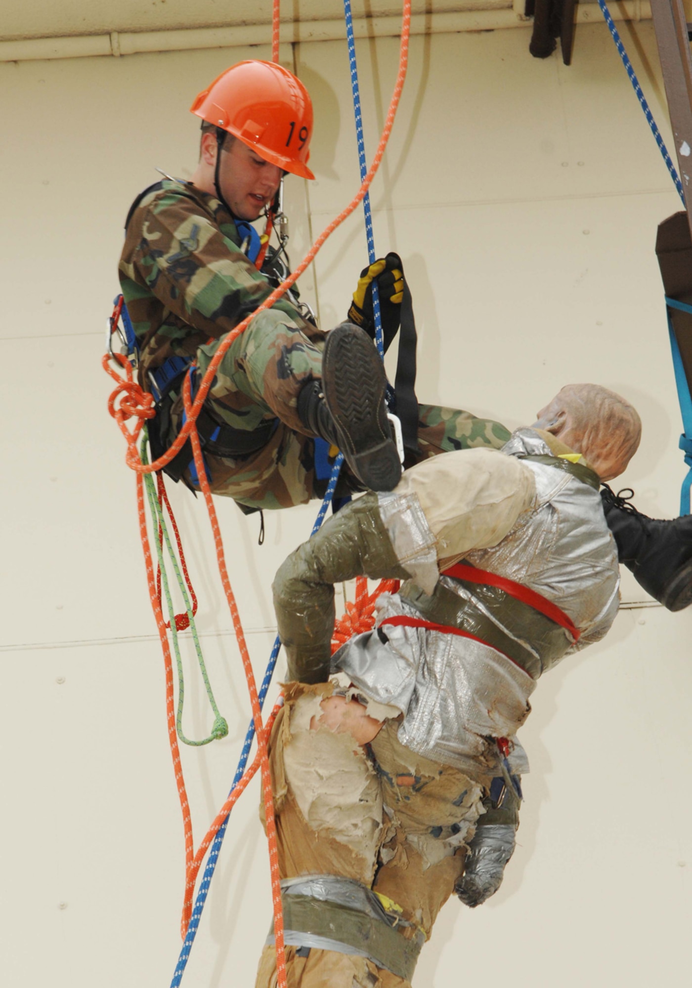 SPANGDAHLEM AIR BASE, Germany-- Airman Jason Smith, 52nd Fire and Emergency Services Flight rappels to save a simulated victim during a High Angle Rescue exercise April 18, 2008. The exercise is part of Rescue Technician Level 1 training that several of the firefighters received to enhance their ability to respond to emergencies. U.S. Air Force photo by Senior Airman Logan A. Tuttle. (Released)