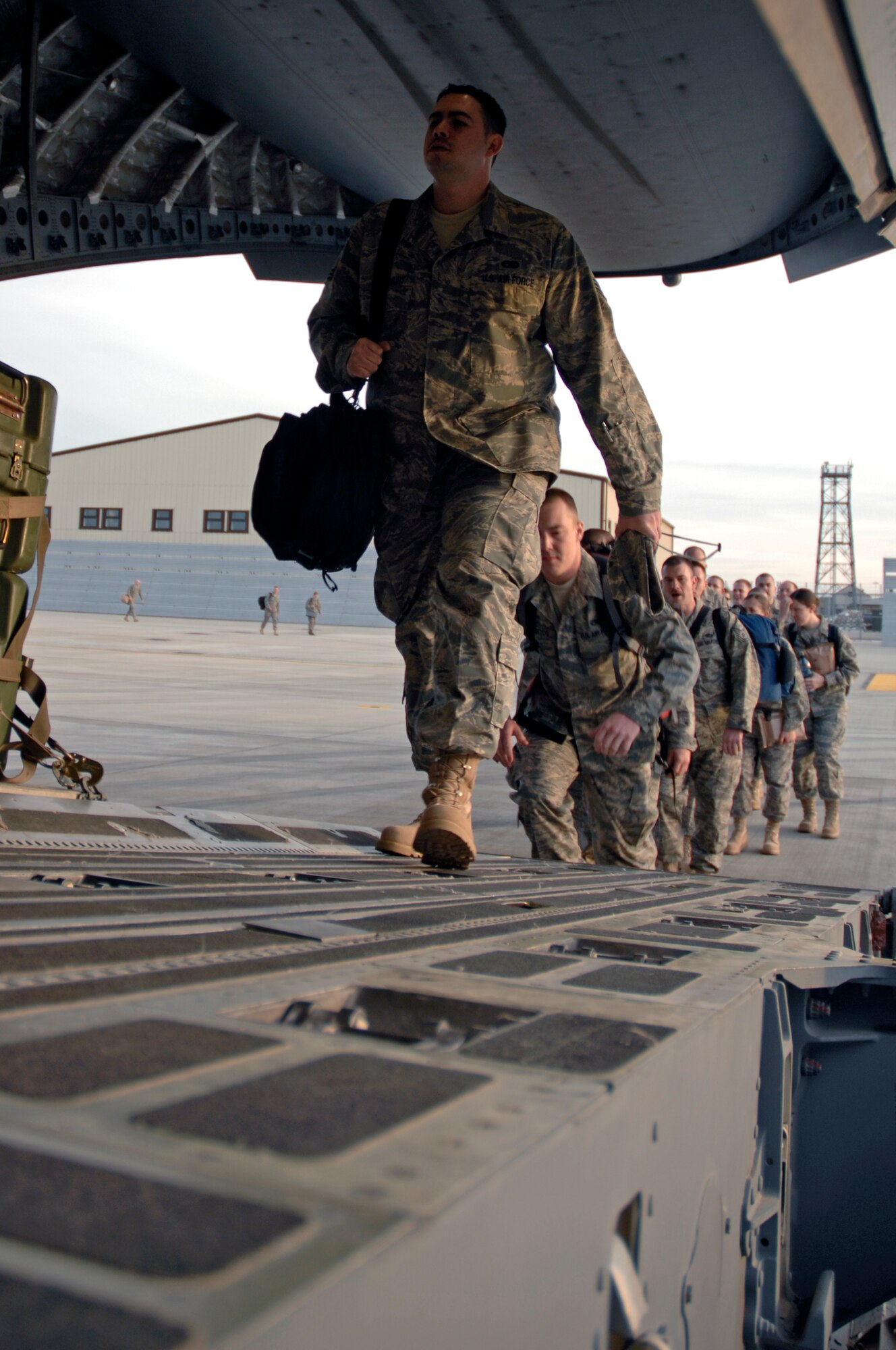 Airmen from the 48th Fighter Wing board a C-17 Globemaster III April 26 at RAF Lakenheath, England. More than 400 Liberty Warriors deployed in support of Operations Iraqi and Enduring Freedom. (U.S. Air Force photo by Airman Perry Aston)