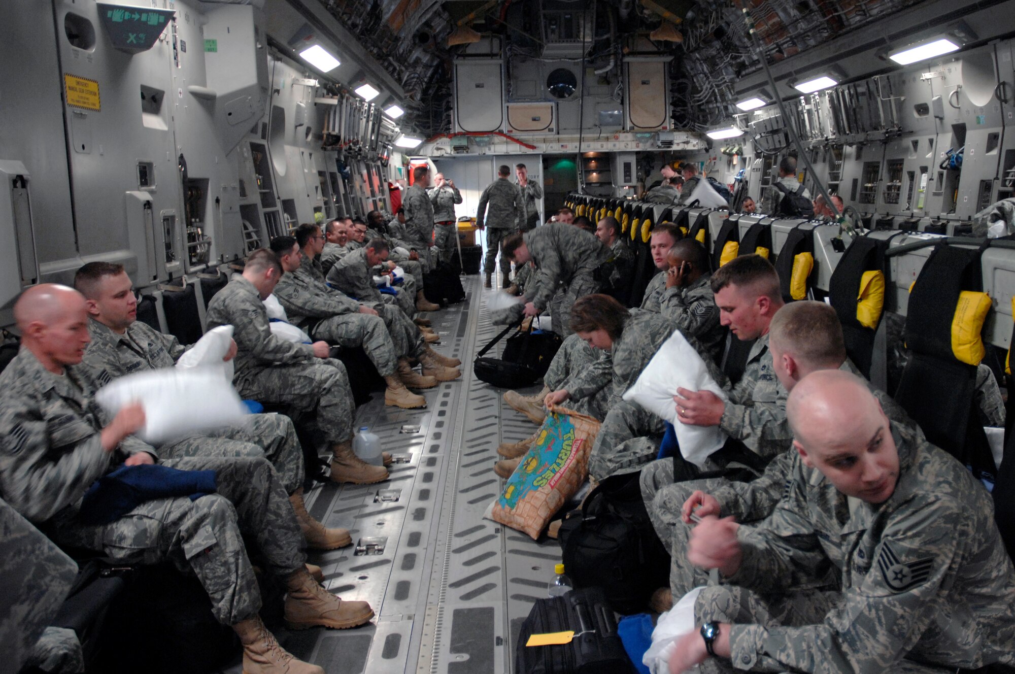48th Fighter Wing Airmen settle in their seats and prepare to take off in a C-17 Globemaster III April 26 at RAF Lakenheath, England. More than 400 Airmen deployed in support of Operations Iraqi and Enduring Freedom.  (U.S. Air Force photo by Airman Perry Aston)