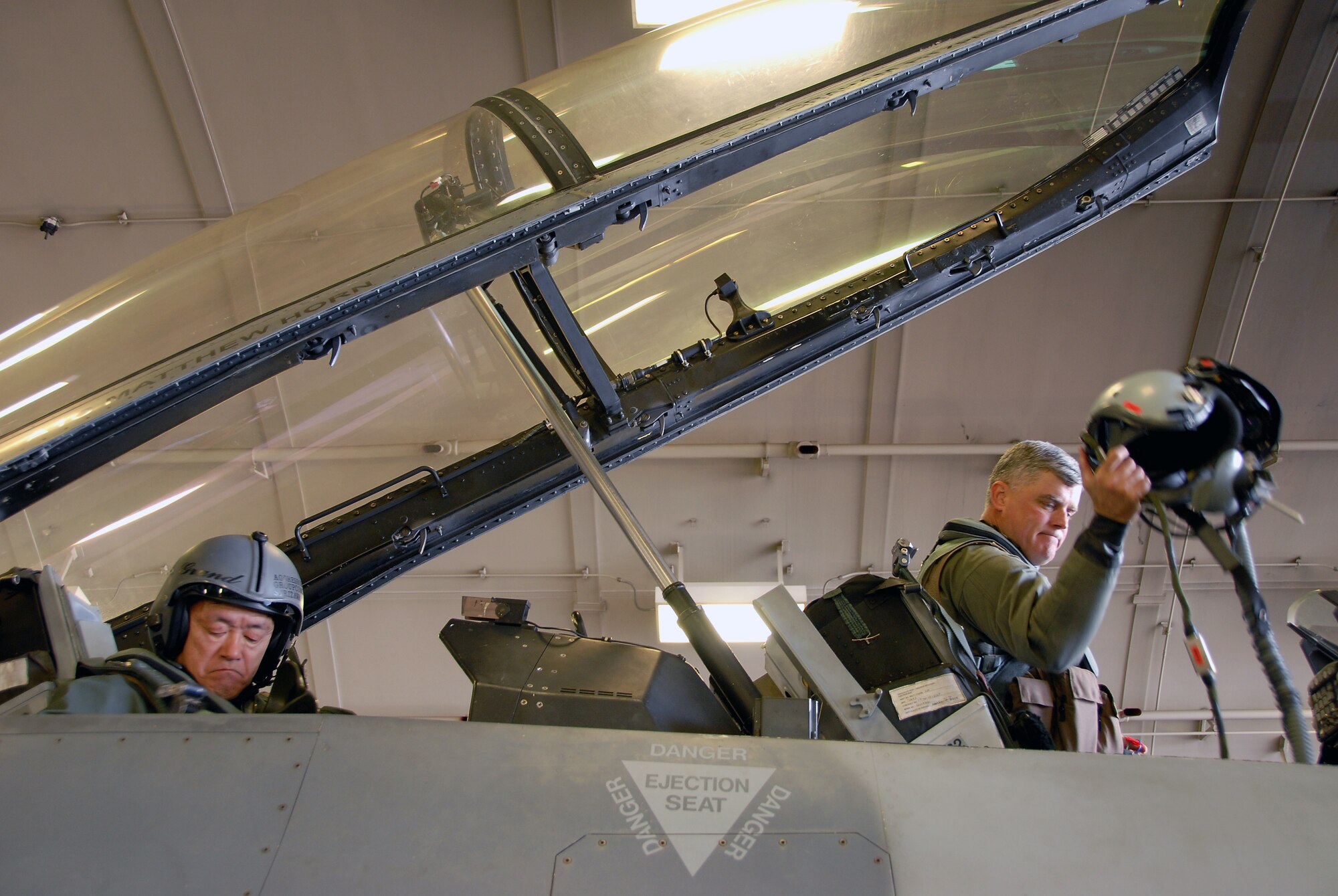 MISAWA AIR BASE, Japan -- Lt. Gen. Shigeru Irizawa, Northern Air Defense Force commander, and Col. Joel Malone, 35th Fighter Wing vice commander, settle into the cockpit of an F-16 Fighting Falcon before taxiing onto the runway during a familiarization flight here on April 15, 2008.  The familiarization flight was intended to help build understanding between the American and Japanese forces in Japan.(U.S. Air Force photo by Senior Airman Chad Strohmeyer)
