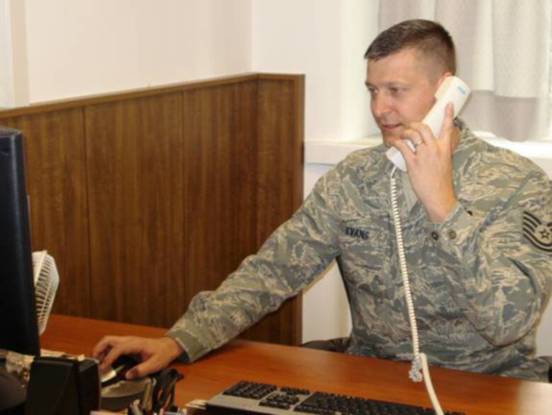 Tech. Sgt. Robert Evans interfaces with senior leadership on a tasking at the Joint NATO Command Branch office. (U.S Air Force Photo by Tech. Sgt. Regina Brewer)

